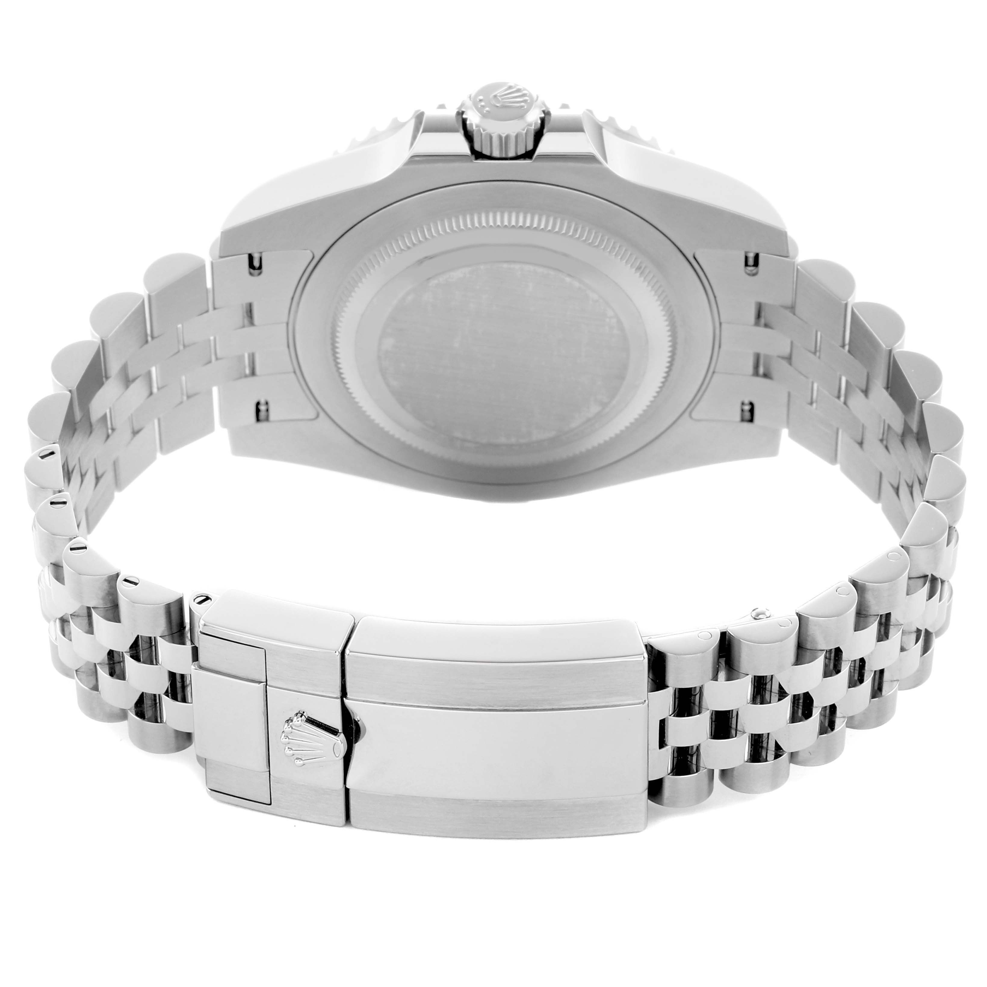 The image shows the back of a Rolex GMT-Master 126710GRNR Men's Stainless Steel Black Dial watch with its clasp and bracelet in focus.