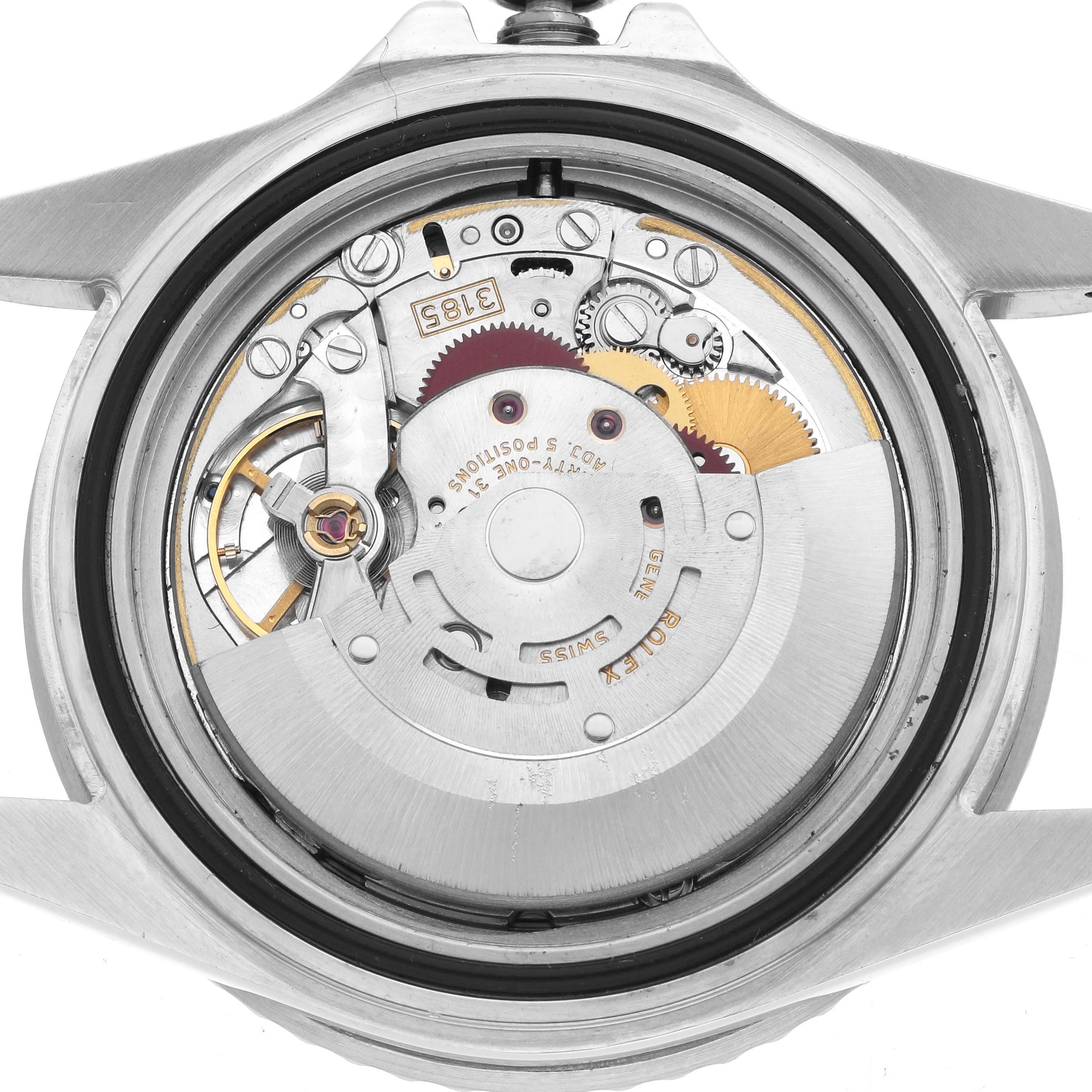 The image shows the movement of a Rolex GMT-Master 16710 Men's Stainless Steel Black Dial, viewed from the back with internal components like gears and balance wheel visible.