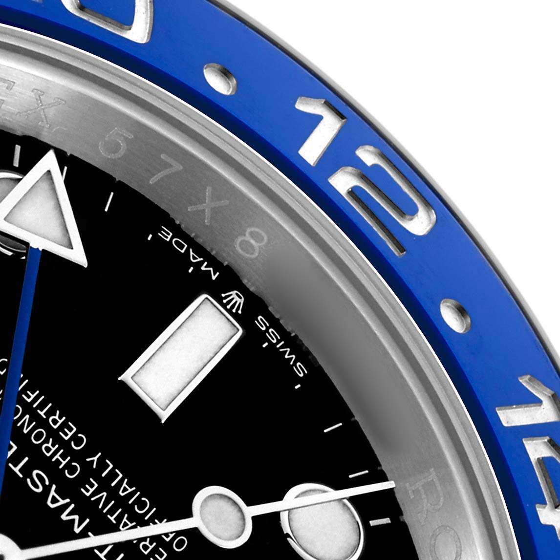 The image shows a close-up of the bezel and part of the dial of a Rolex GMT-Master 126710 Men's Stainless Steel Black Dial, highlighting the blue section.