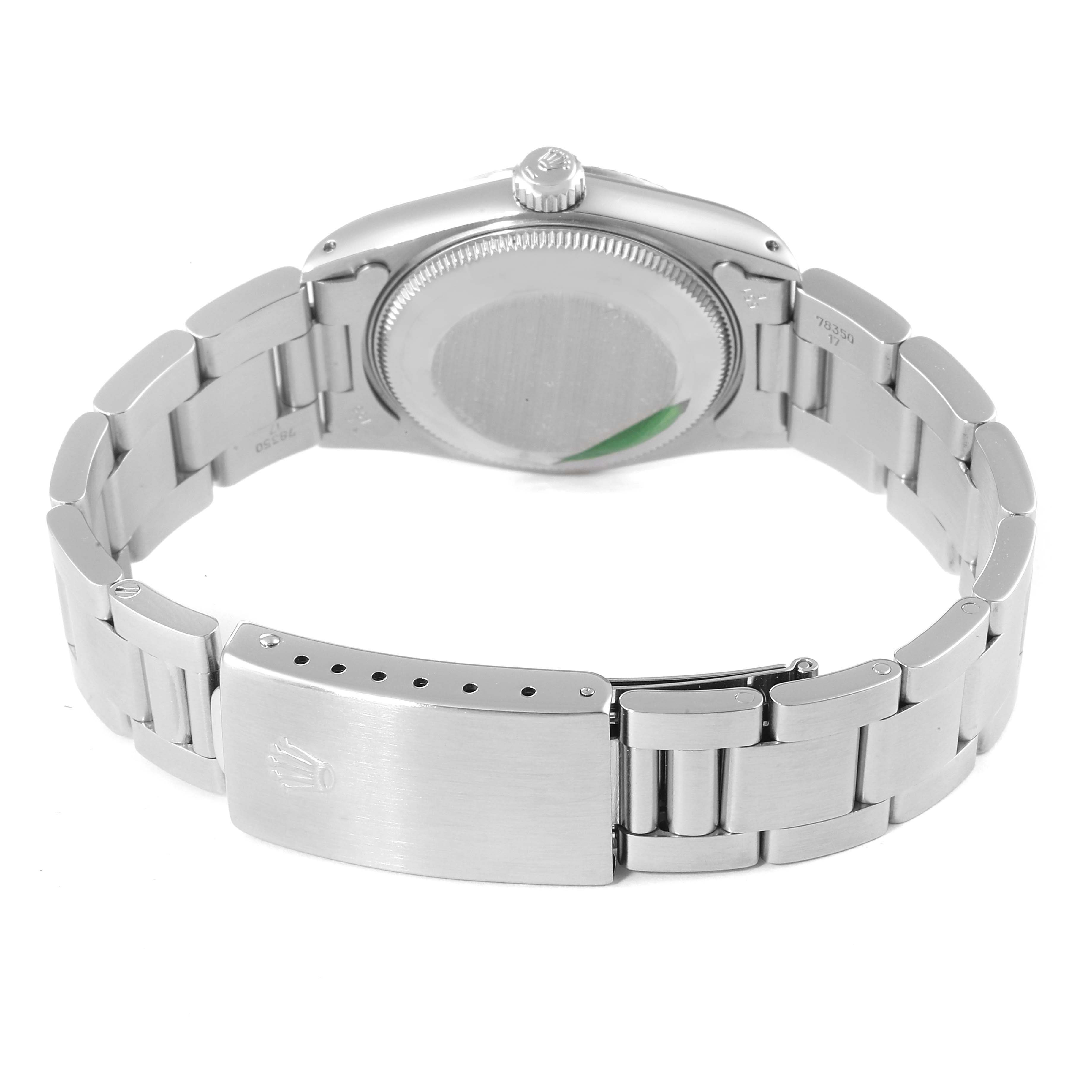 The image shows the back view of a Mid-Size Rolex watch, highlighting its case back, bracelet, and clasp.