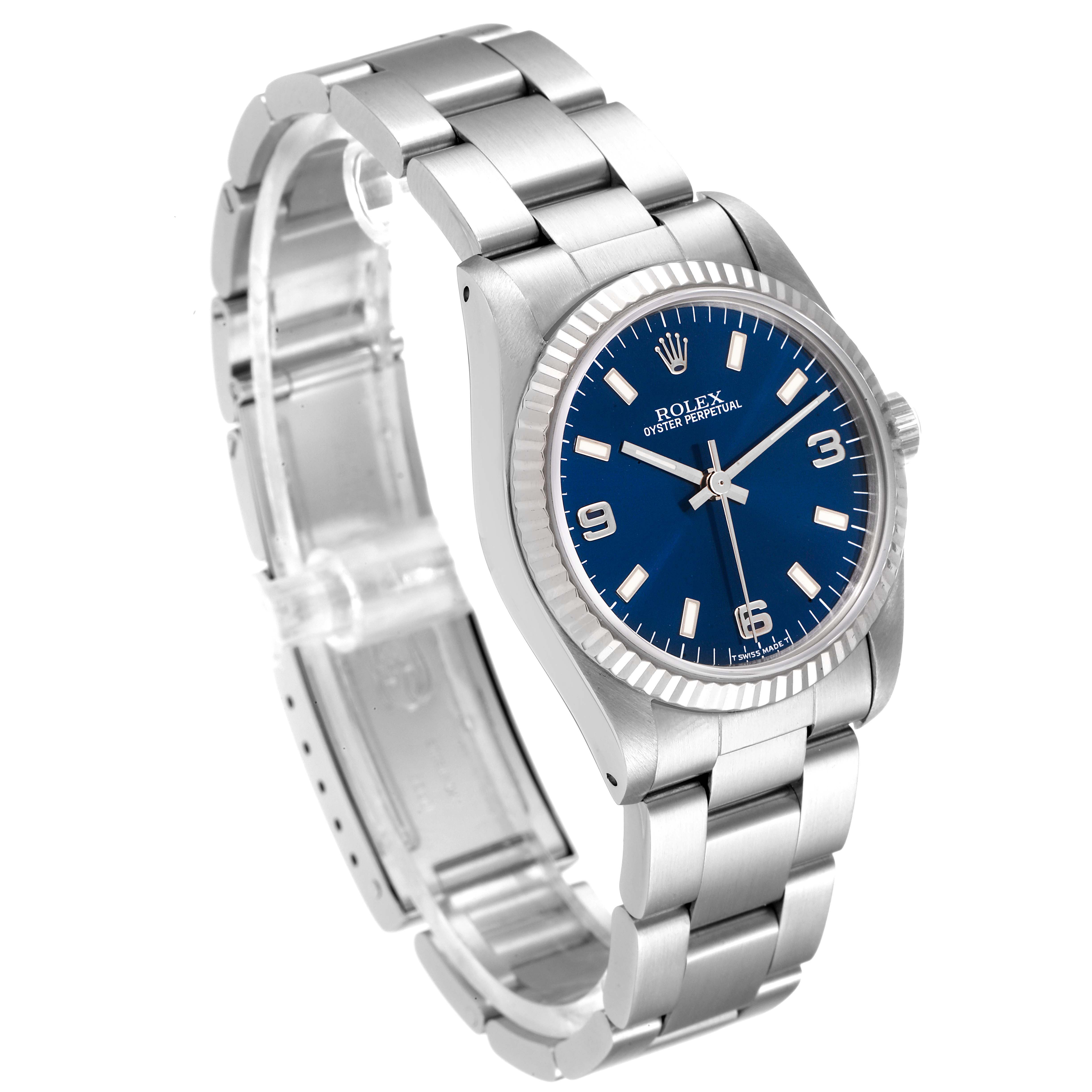 The image displays a Rolex Mid-Size 67514 Women
s Stainless Steel Blue Dial 67514 Women
s Stainless Steel Blue Dial watch, showing the face, bracelet, bezel, and crown, viewed from a slight angle.
