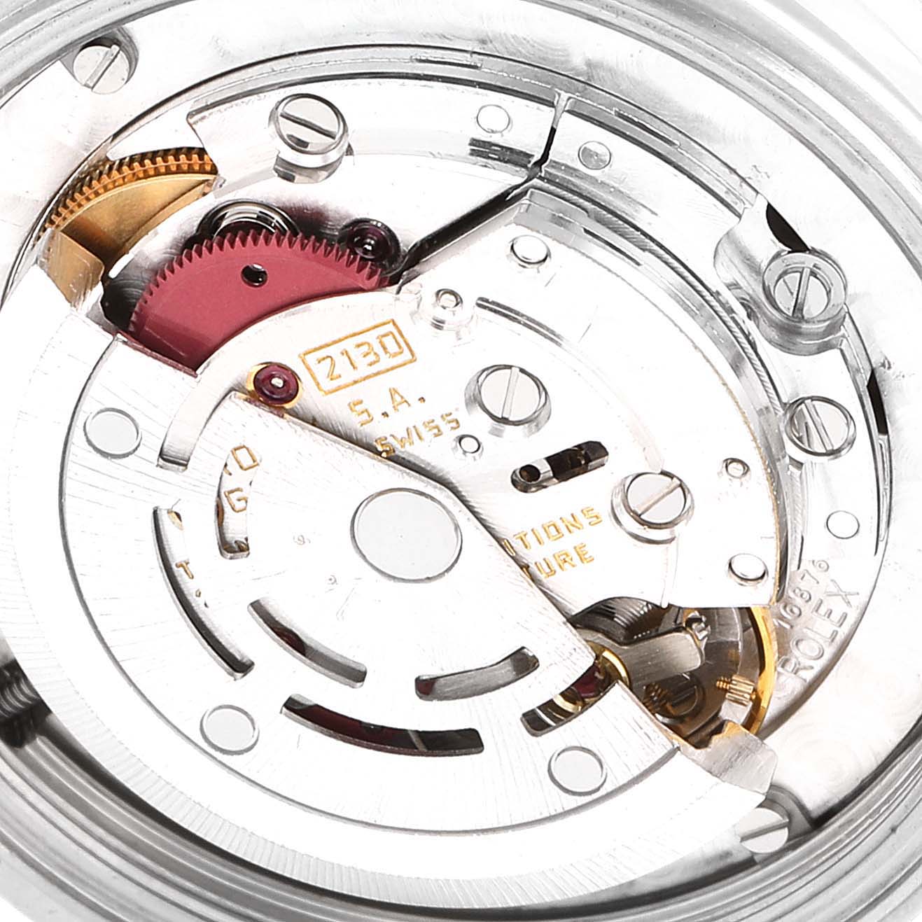 The image shows the internal mechanism of a Rolex Mid-Size 67514 Women
s Stainless Steel Blue Dial 67514 Women
s Stainless Steel Blue Dial watch, focusing on the movement parts and gears.