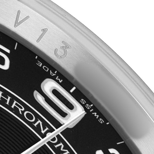 The image shows a close-up of the dial and bezel of a Rolex Oyster Perpetual 116000 Men's Stainless Steel Black Dial watch.