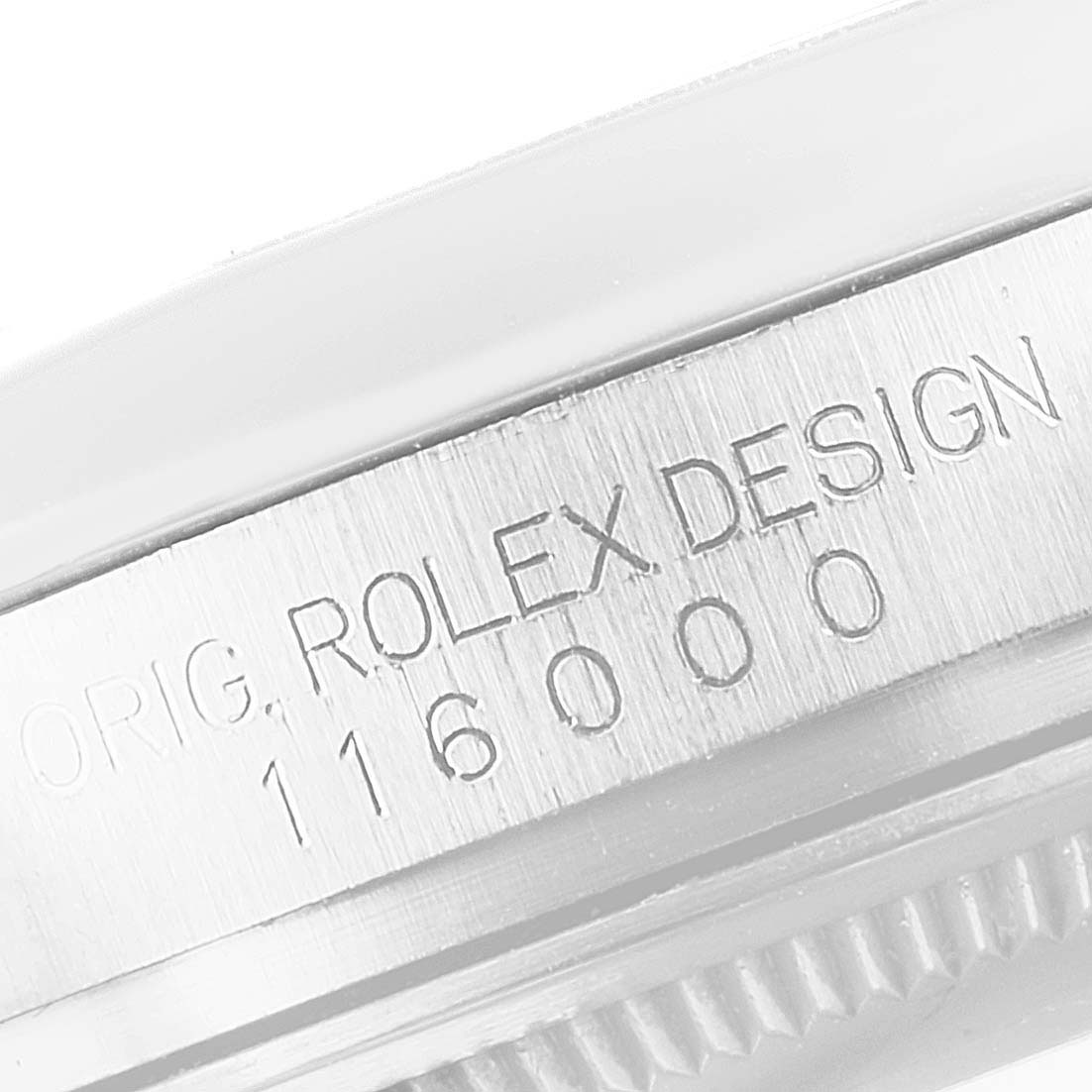 The image shows a close-up of the side of a Rolex Oyster Perpetual 116000 Men's Stainless Steel Silver Dial, highlighting the engraved model number.