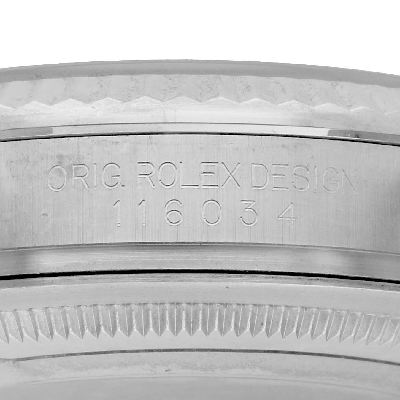 The image shows a close-up of the case side of a Rolex Oyster Perpetual 116034 Men
s Stainless Steel White Dial watch, highlighting the model number engraving.