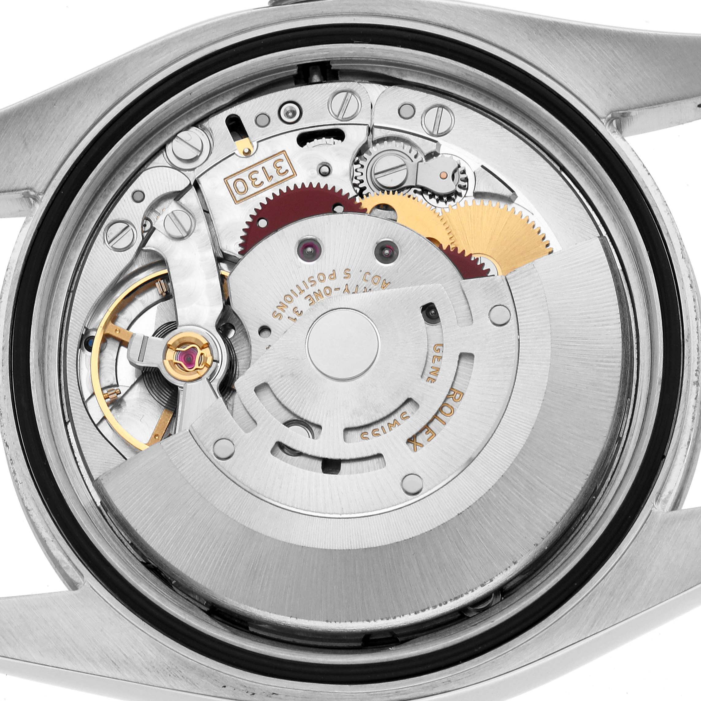 The image shows the movement of a Rolex Oyster Perpetual 116034 Men
s Stainless Steel White Dial watch from the back, displaying its intricate gears and components.