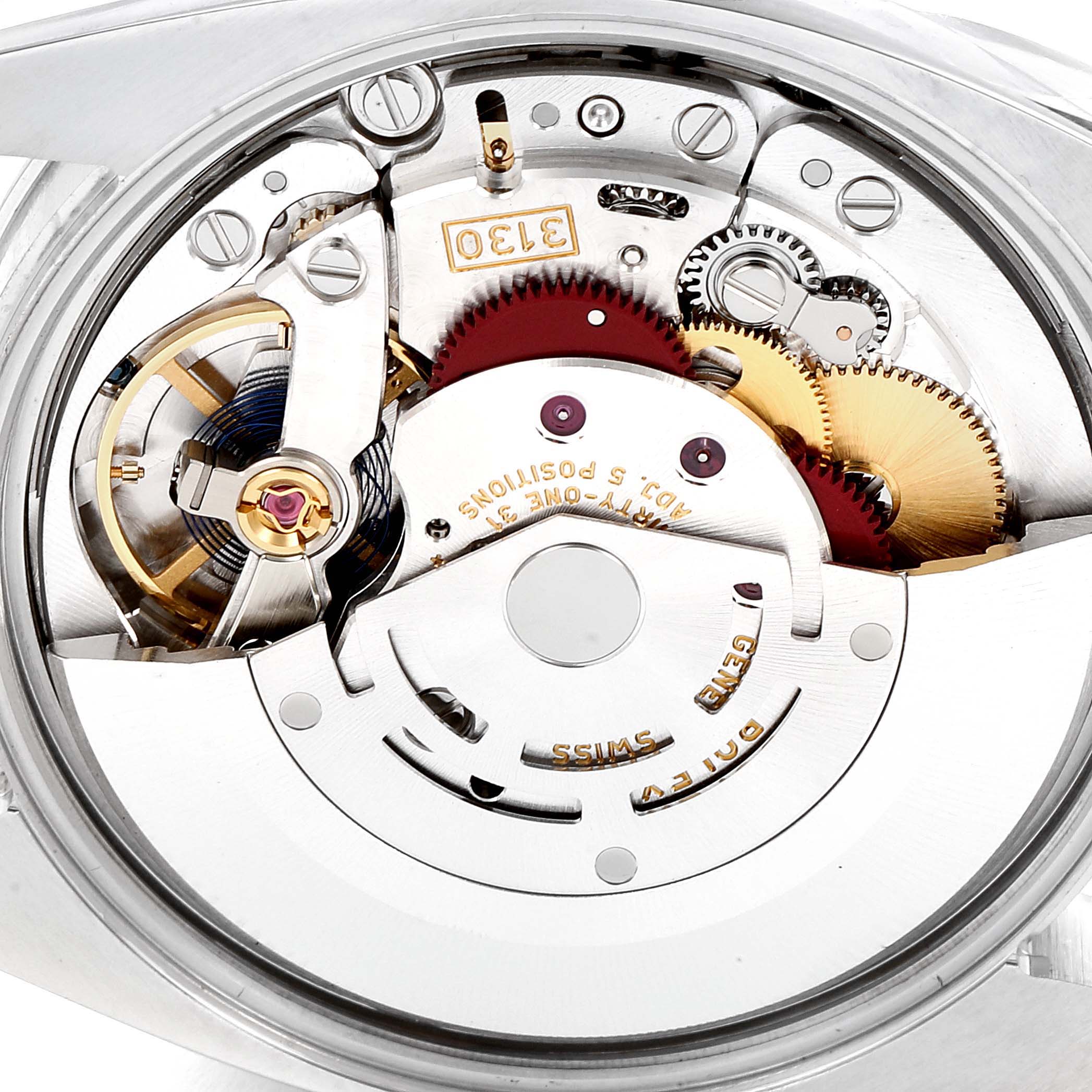 The image shows the internal mechanism and parts of a Rolex Oyster Perpetual 114200 Men
s Stainless Steel Black Dial 114200 Men
s Stainless Steel Black Dial watch, viewed from the back.