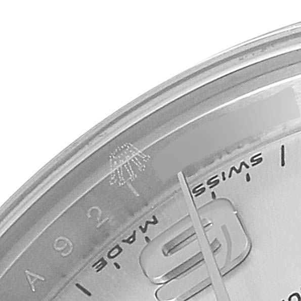 The image shows a close-up of the right side of the Rolex Oyster Perpetual 176200 Women
s Stainless Steel Silver Dial 176200 Women
s Stainless Steel Silver Dial watch dial, focusing on the "SWISS MADE" text and part of the hour markers.
