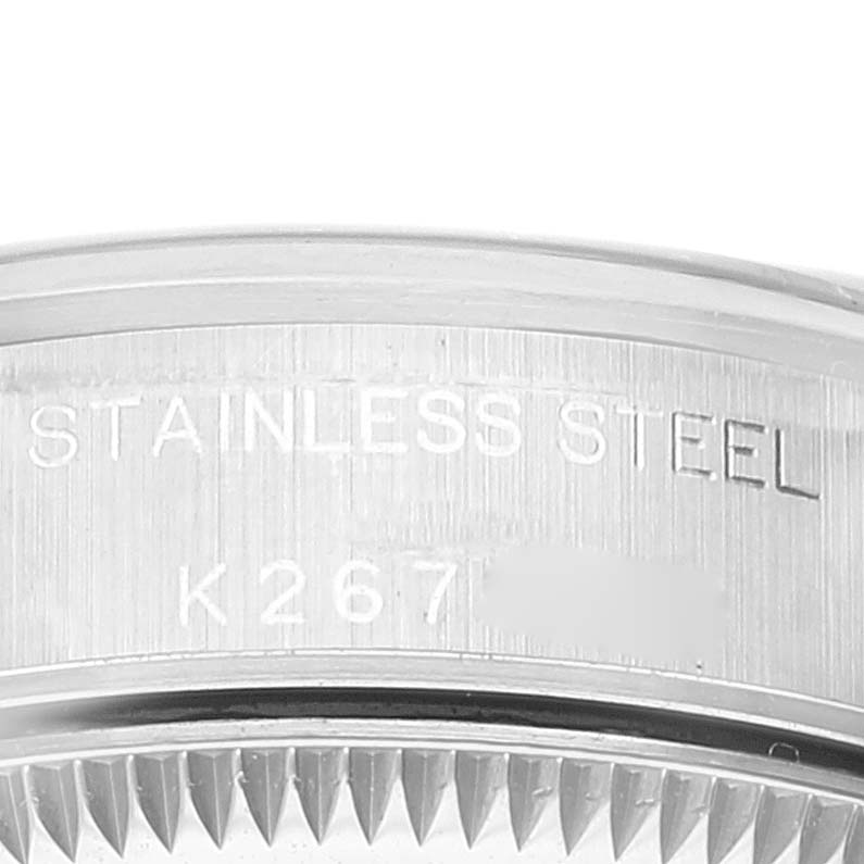 This image shows a close-up angle of the engraved stainless steel case back of a Rolex Oyster Perpetual 76080 Women
s Stainless Steel Blue Dial 76080 Women
s Stainless Steel Blue Dial watch.