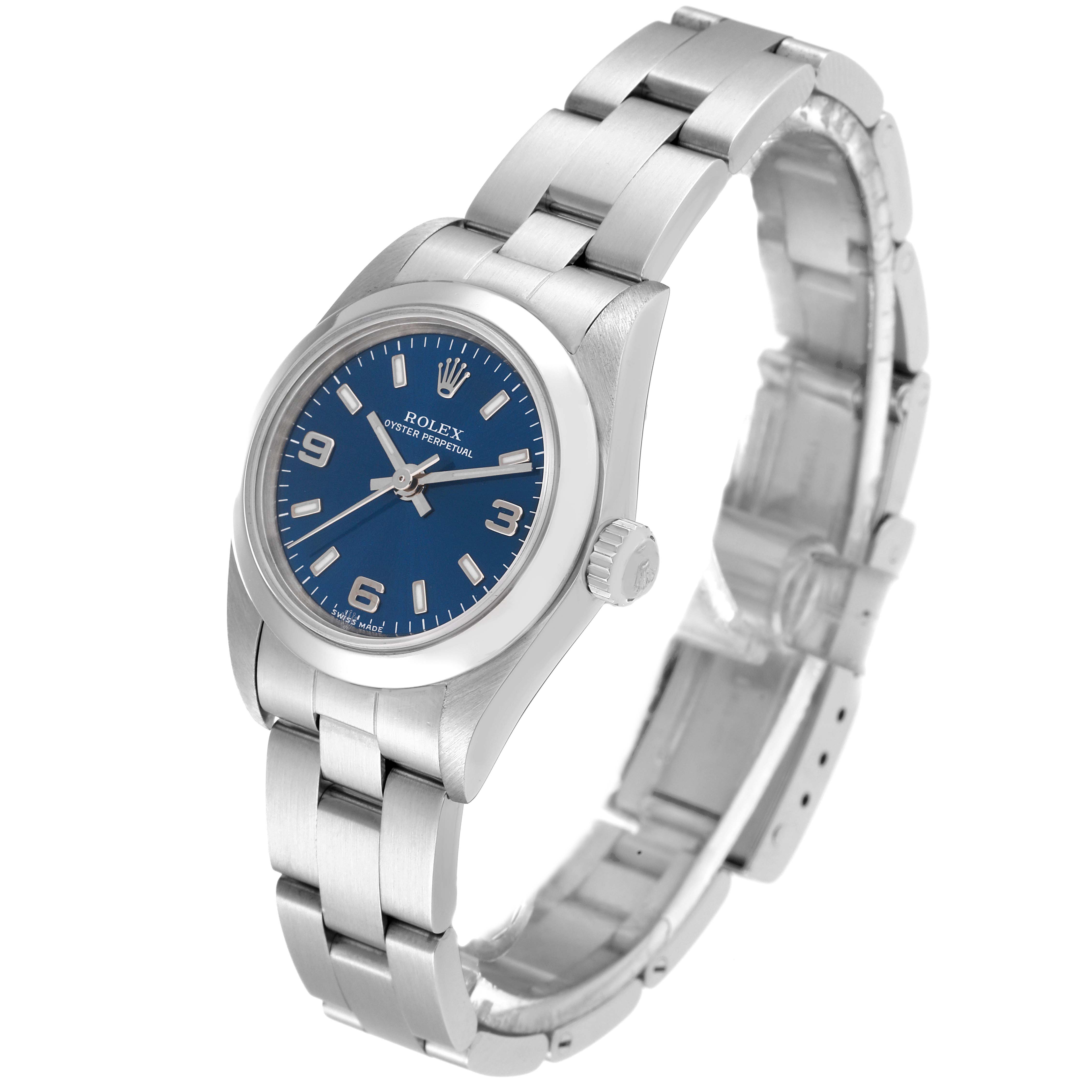 The Rolex Oyster Perpetual 76080 Women
s Stainless Steel Blue Dial 76080 Women
s Stainless Steel Blue Dial watch is shown at an angled view, displaying the face, casing, and part of the bracelet.