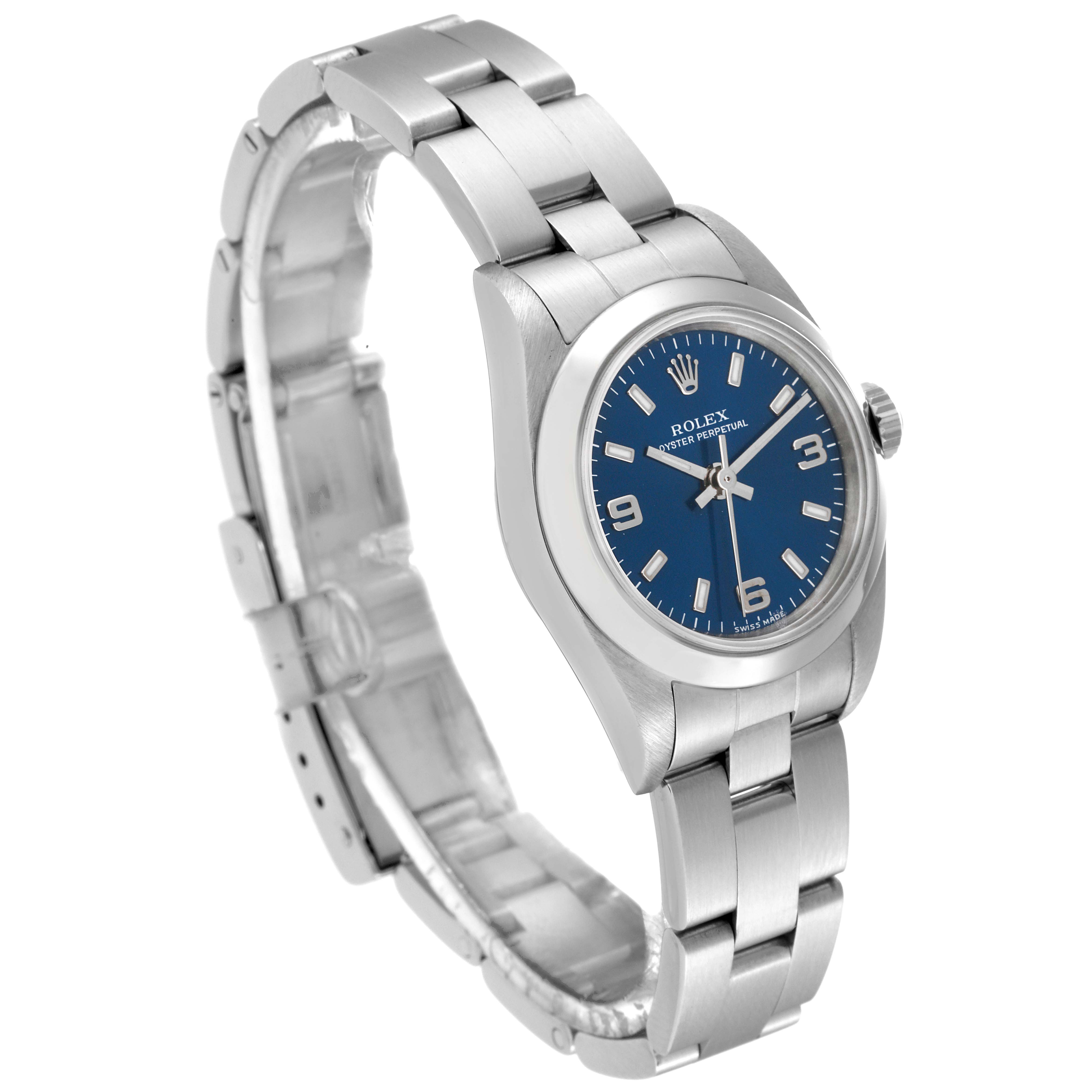 This image shows a Rolex Oyster Perpetual 76080 Women
s Stainless Steel Blue Dial 76080 Women
s Stainless Steel Blue Dial watch from a three-quarter angle, highlighting the blue dial, bezel, crown, and metal bracelet.