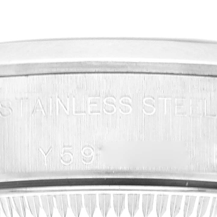 This is a close-up shot of the side of a Rolex Oyster Perpetual 76080 Women
s Stainless Steel Blue Dial 76080 Women
s Stainless Steel Blue Dial watch, showing the stainless steel inscription.