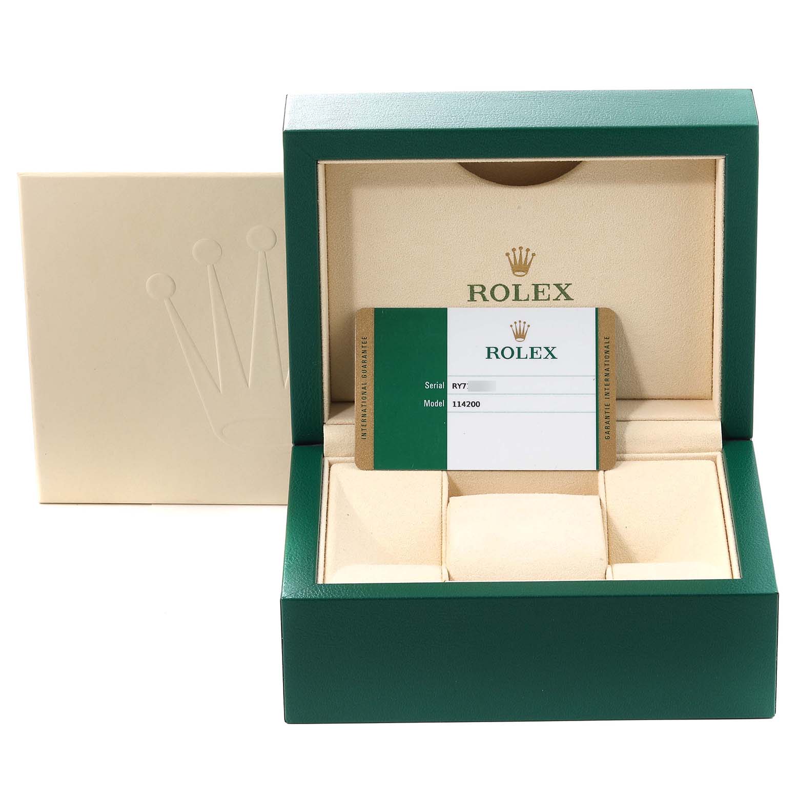 The image shows the packaging, warranty card, and box for a Rolex Oyster Perpetual 114200 Men
s Stainless Steel White Dial 114200 Men
s Stainless Steel White Dial model 114200.
