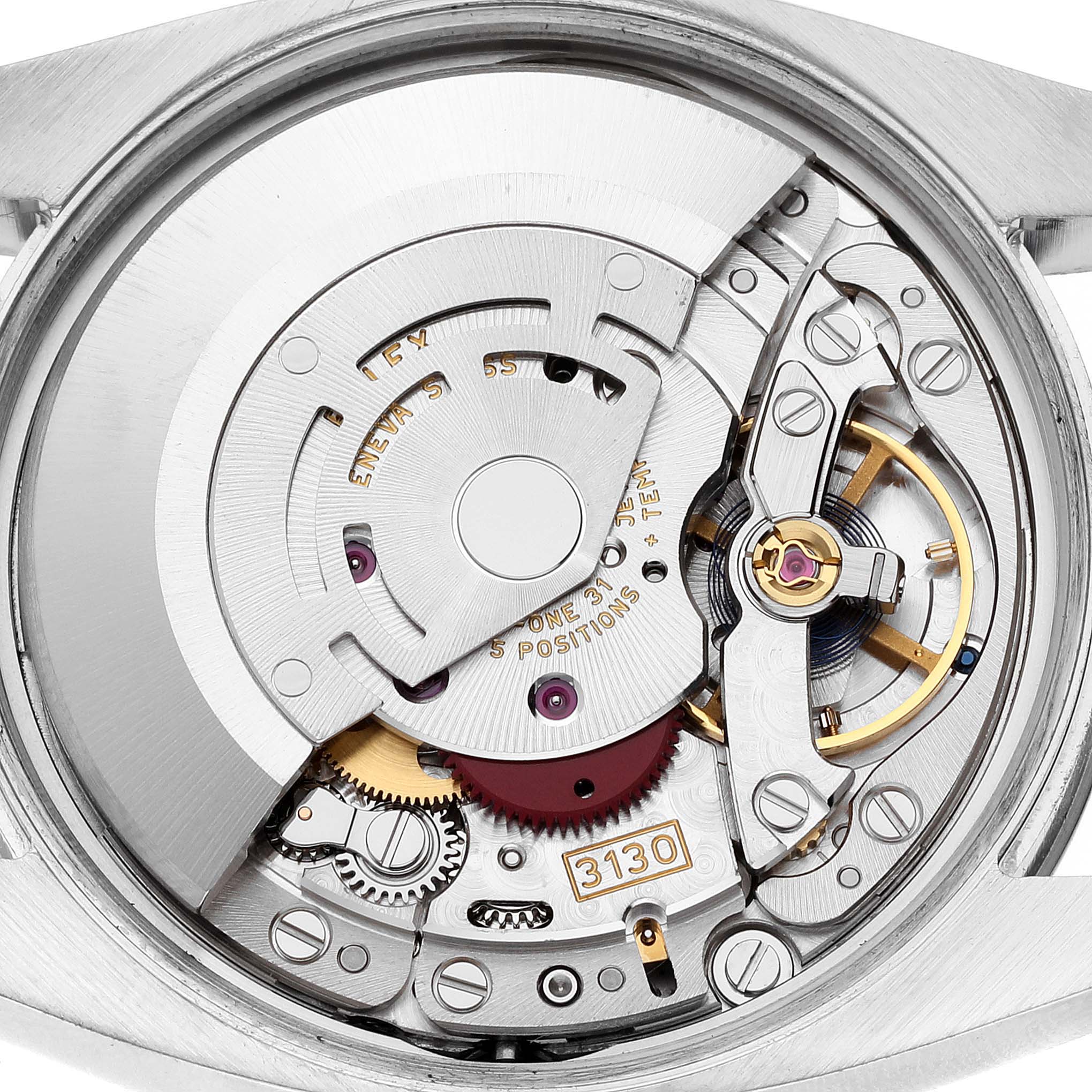 The image shows the internal mechanical movement of the Rolex Oyster Perpetual 114200 Men
s Stainless Steel White Dial 114200 Men
s Stainless Steel White Dial watch from a top-down angle.