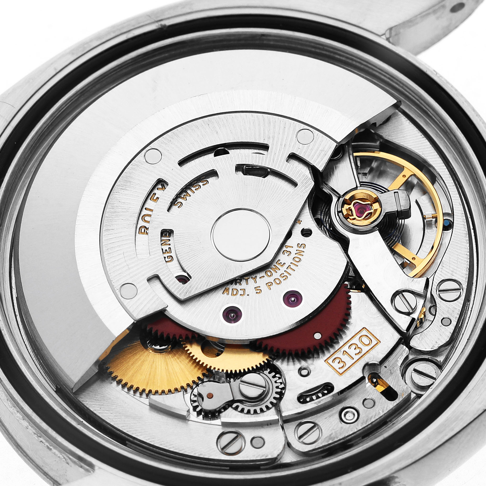 The image shows the movement of a Rolex Oyster Perpetual 116034 Men's Stainless Steel Black Dial watch, highlighting gears, rotor, and balance wheel from a close-up angle.