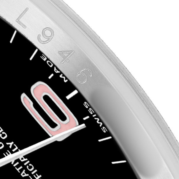 The image shows a close-up of the bezel and dial of a Rolex Oyster Perpetual 116034 Men's Stainless Steel Black Dial, highlighting the numbers and minute markers.