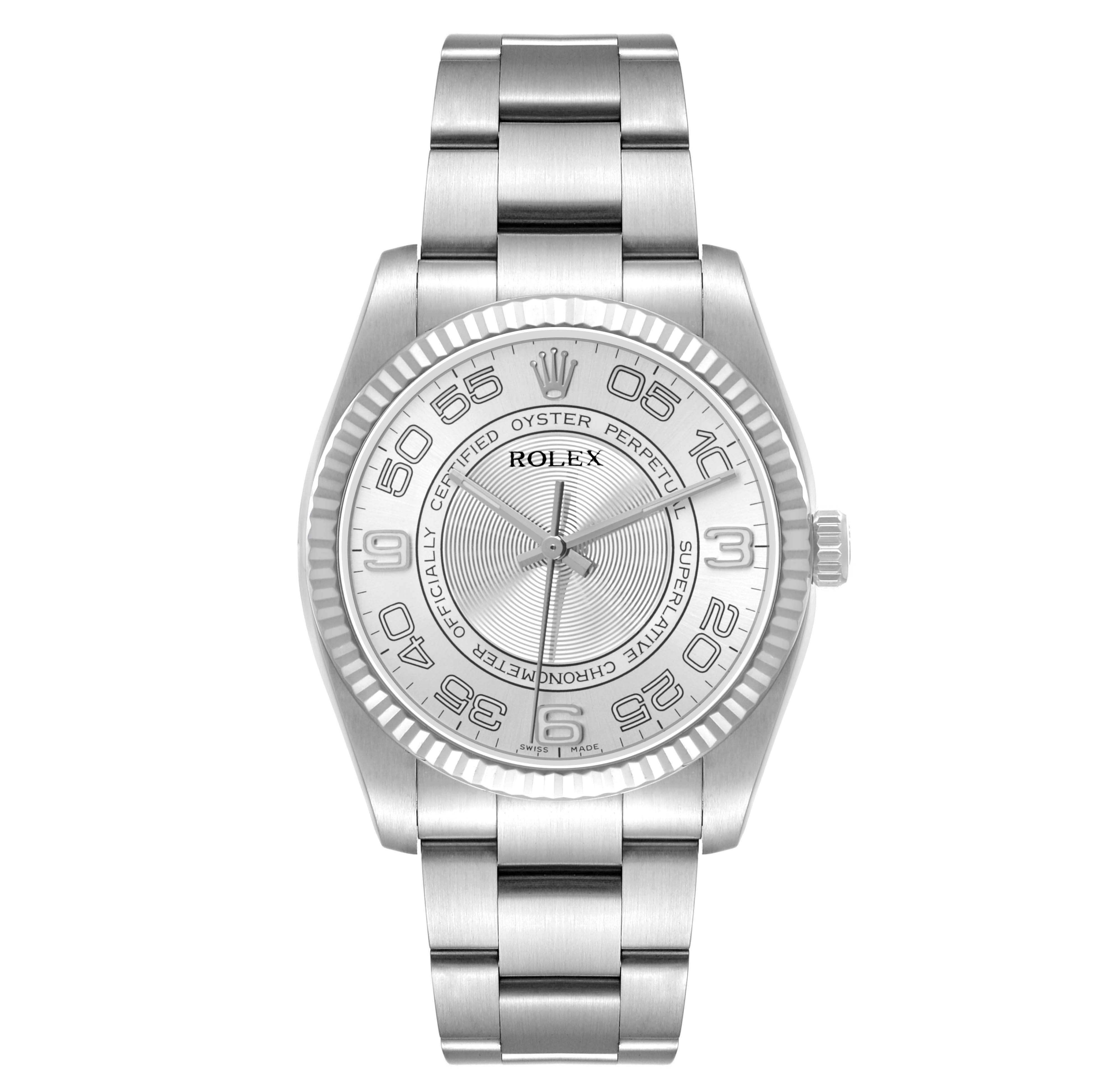 The Rolex Oyster Perpetual 116034 Men's Stainless Steel Silver Dial watch is shown from a top-down angle, displaying the full face, bezel, and bracelet.