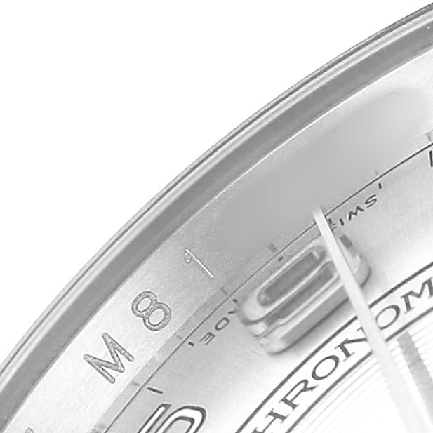 The image shows a close-up of the dial edge and hands of the Rolex Oyster Perpetual 116034 Men's Stainless Steel Silver Dial watch, focusing on details like markers and text.