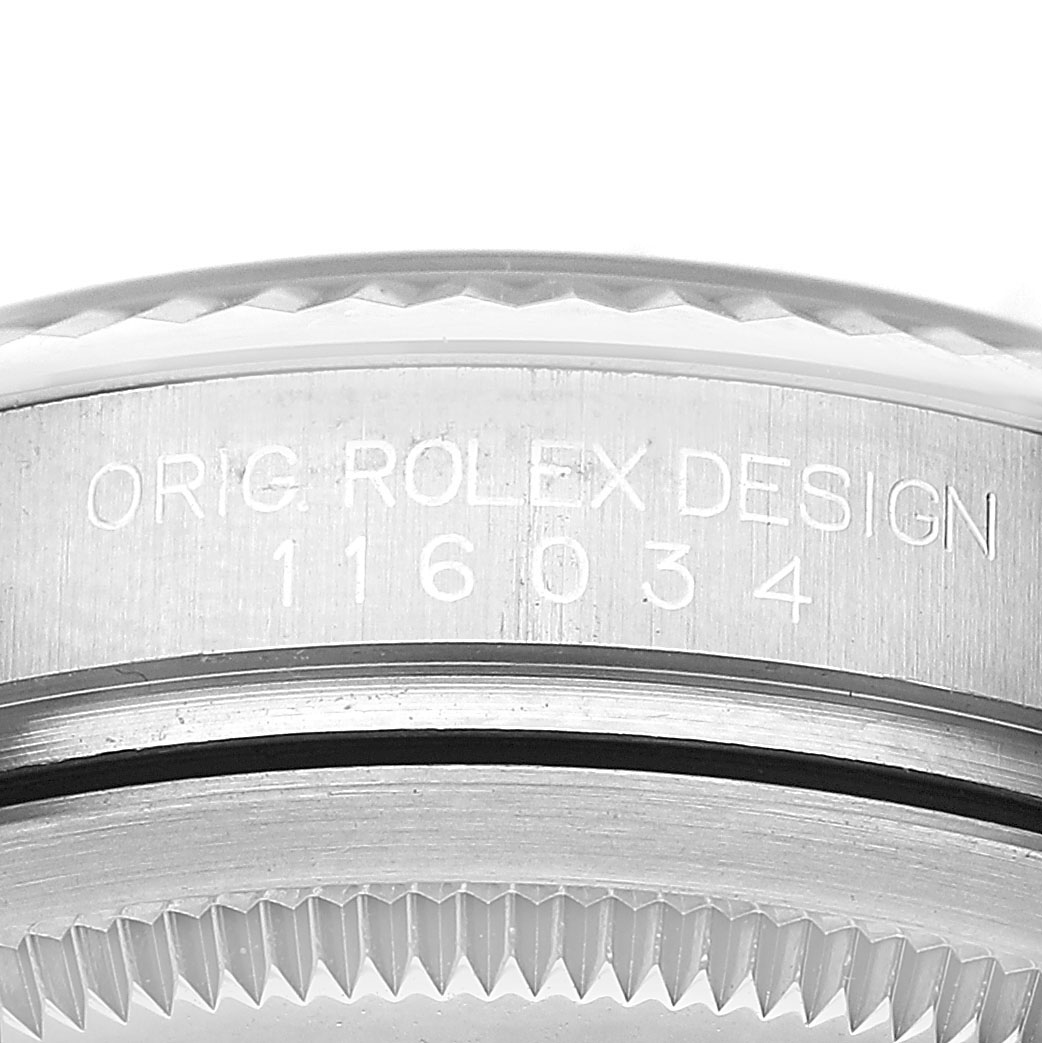 The image shows a close-up of the side of the case for a Rolex Oyster Perpetual 116034 Men's Stainless Steel Silver Dial, displaying its model number and design engraving.
