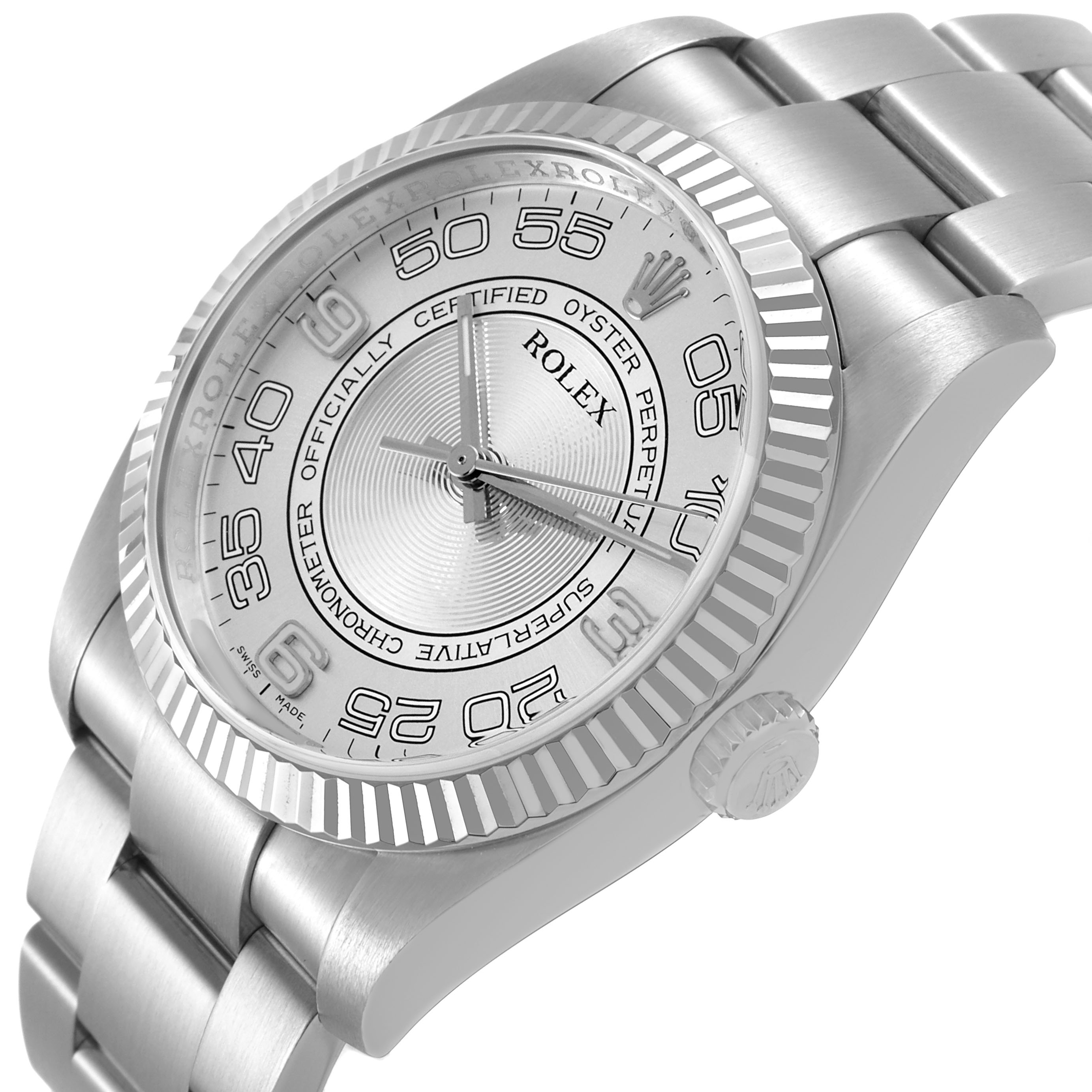 The Rolex Oyster Perpetual 116034 Men's Stainless Steel Silver Dial watch is shown at an angle highlighting the face, fluted bezel, crown, and part of the bracelet.
