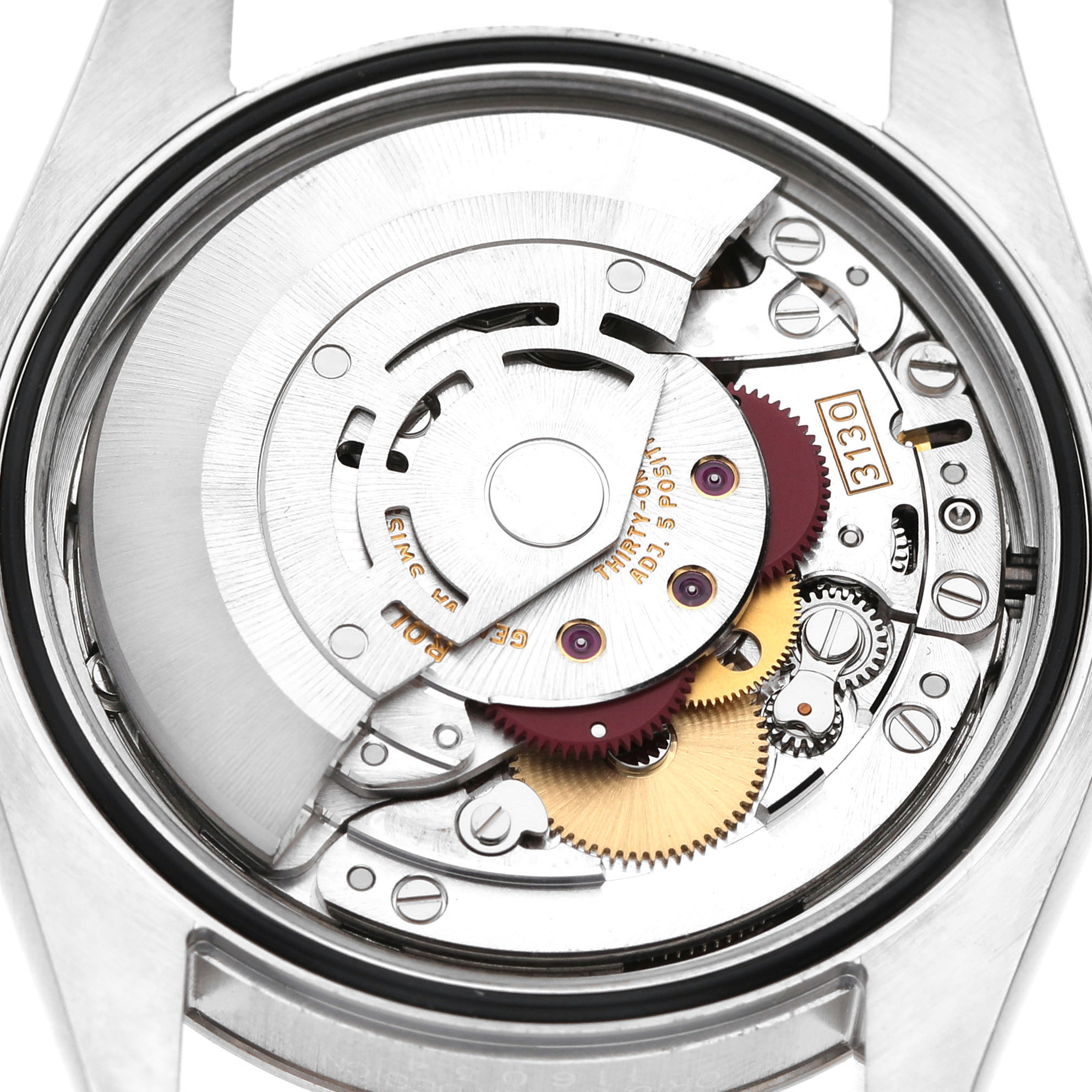 The image shows the movement mechanism of a Rolex Oyster Perpetual 116034 Men's Stainless Steel Silver Dial watch from the back, highlighting gears and rotors.