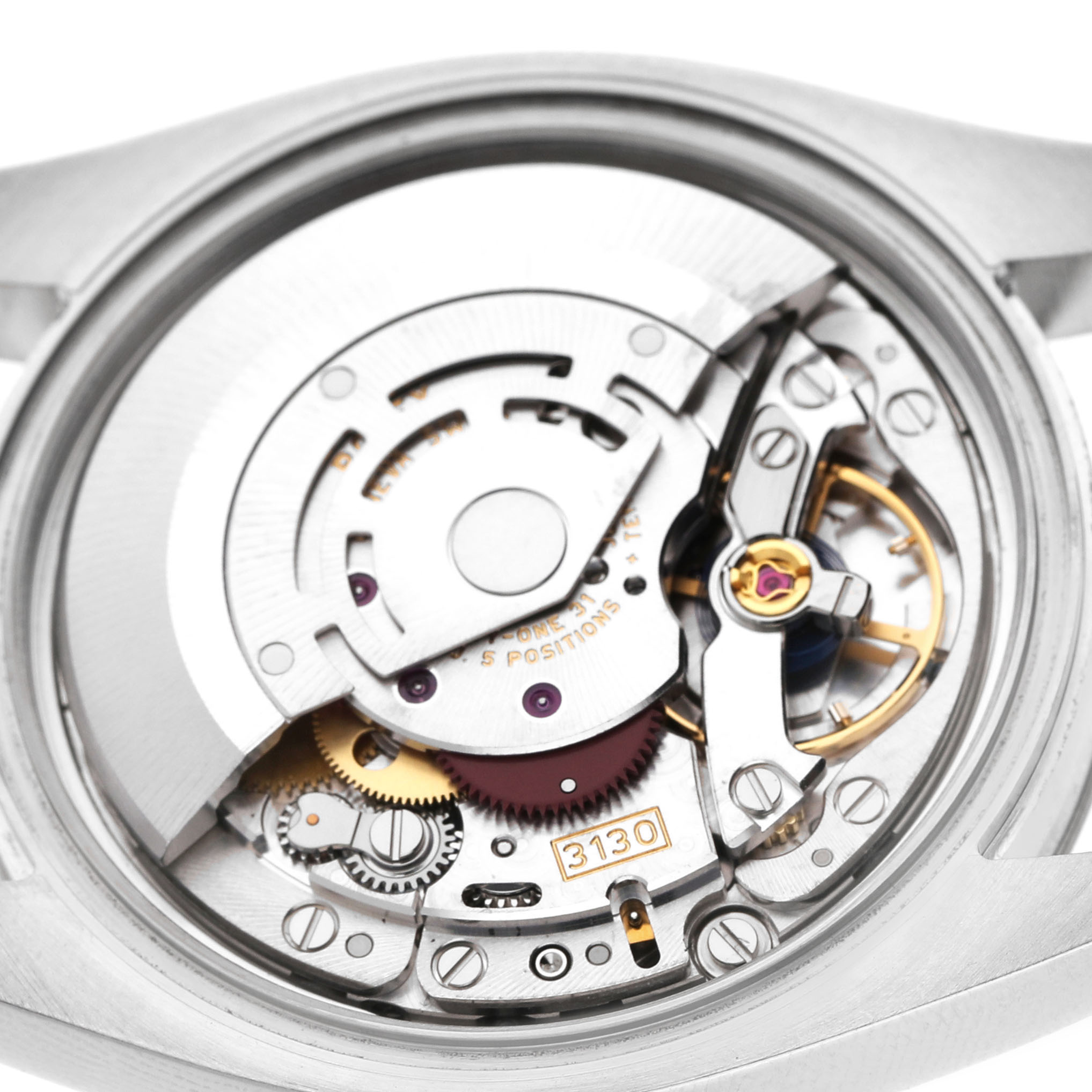 The image shows the movement mechanism of a Rolex Oyster Perpetual 116034 Men's Stainless Steel Silver Dial, viewed from the back with detailed gears and components visible.