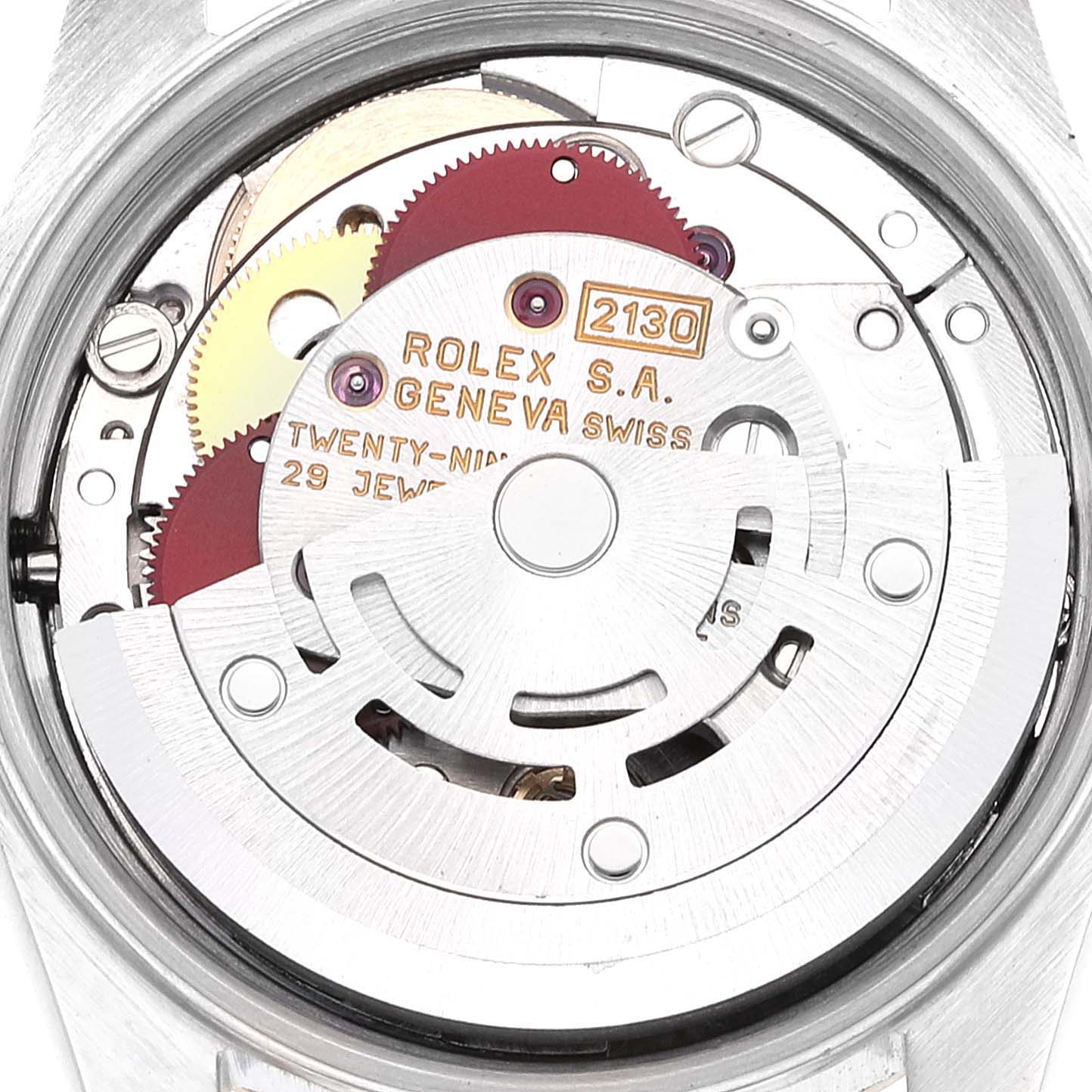 The image shows a close-up view of the movement and inner workings of a Rolex Oyster Perpetual 67193 Women's Steel and Gold (two tone) Champagne Dial 67193 Women's Steel and Gold (two tone) Champagne Dial watch.