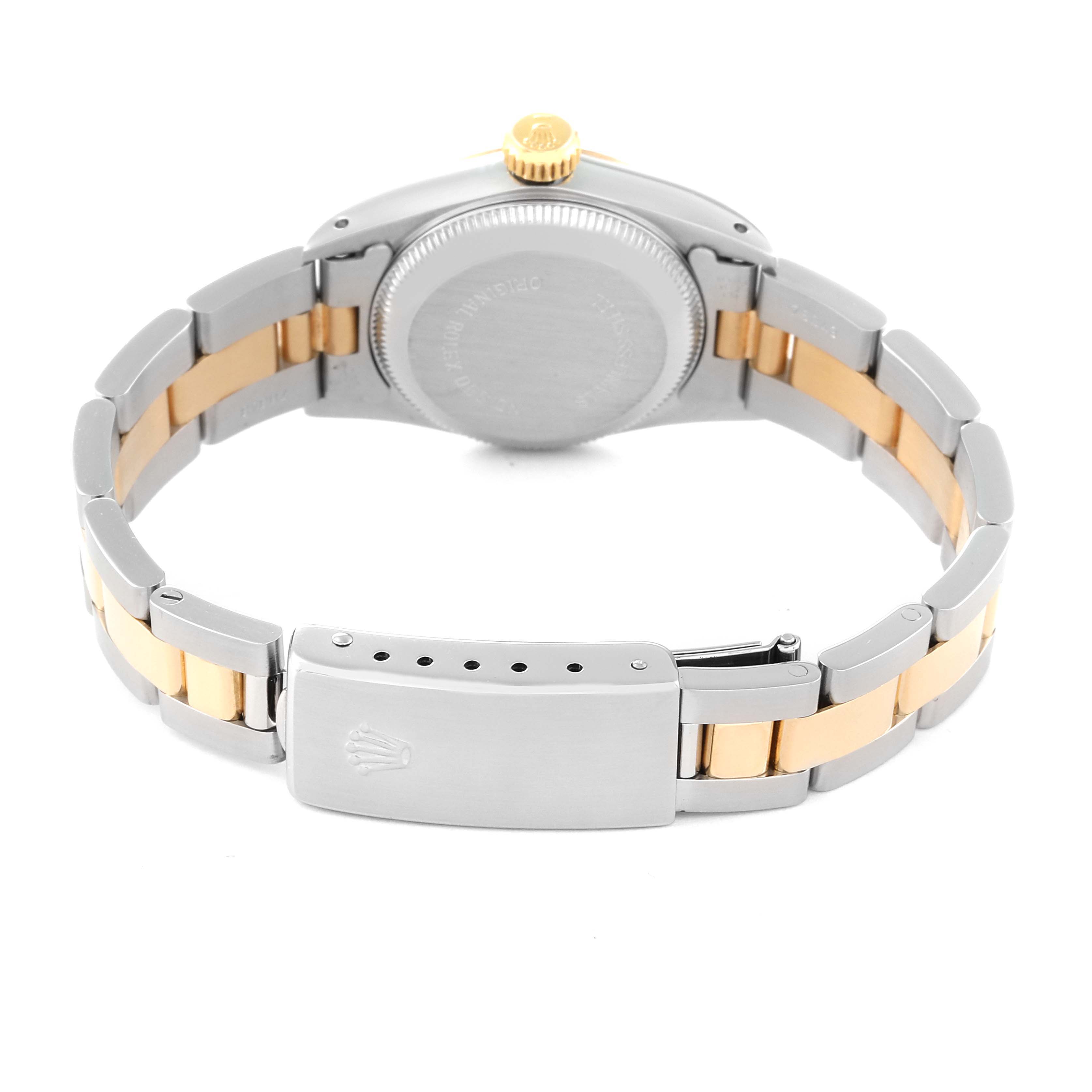 This image shows the Rolex Oyster Perpetual 67193 Women's Steel and Gold (two tone) Champagne Dial 67193 Women's Steel and Gold (two tone) Champagne Dial watch from the back, highlighting the case, crown, and two-tone bracelet with the clasp.