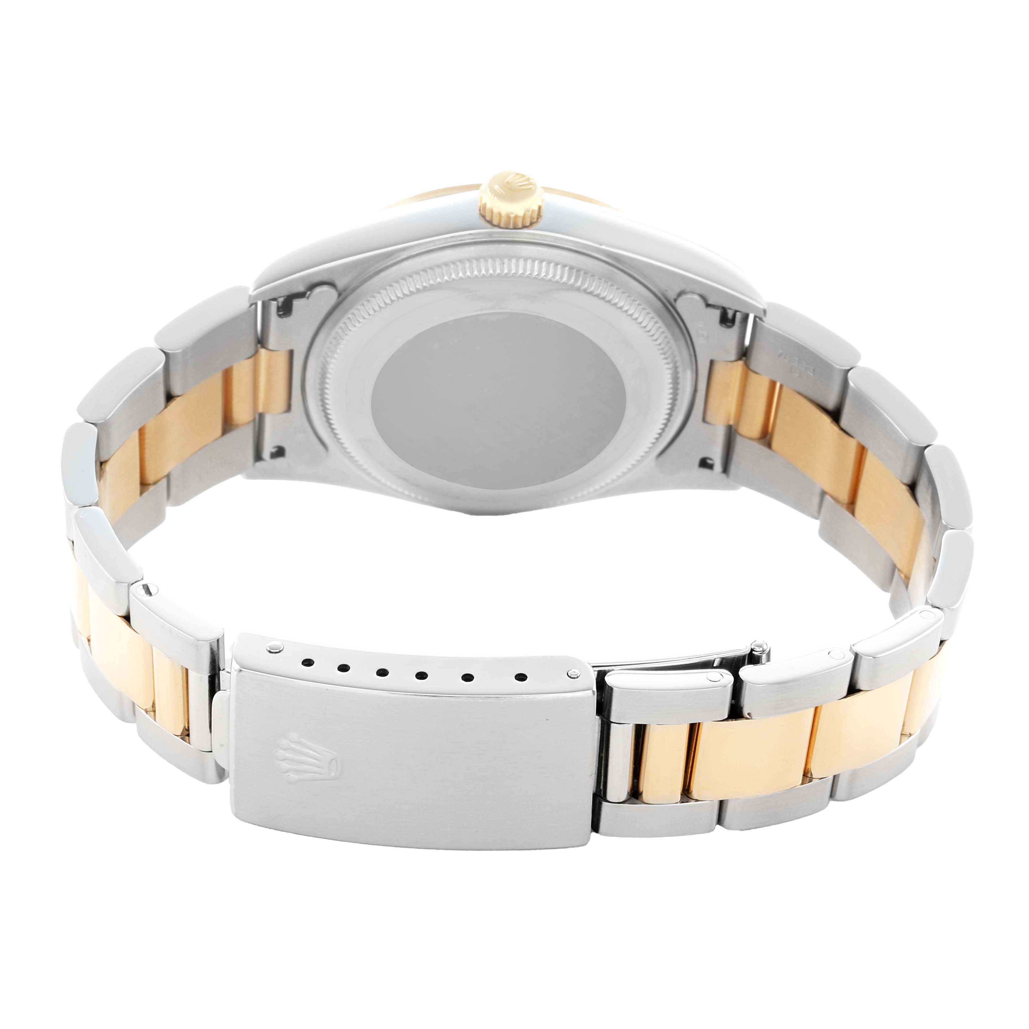 The image shows the back view of a Rolex Oyster Perpetual 14203 Men
s Steel and Gold (two tone) Silver Dial watch, highlighting the case back and two-tone metal bracelet.