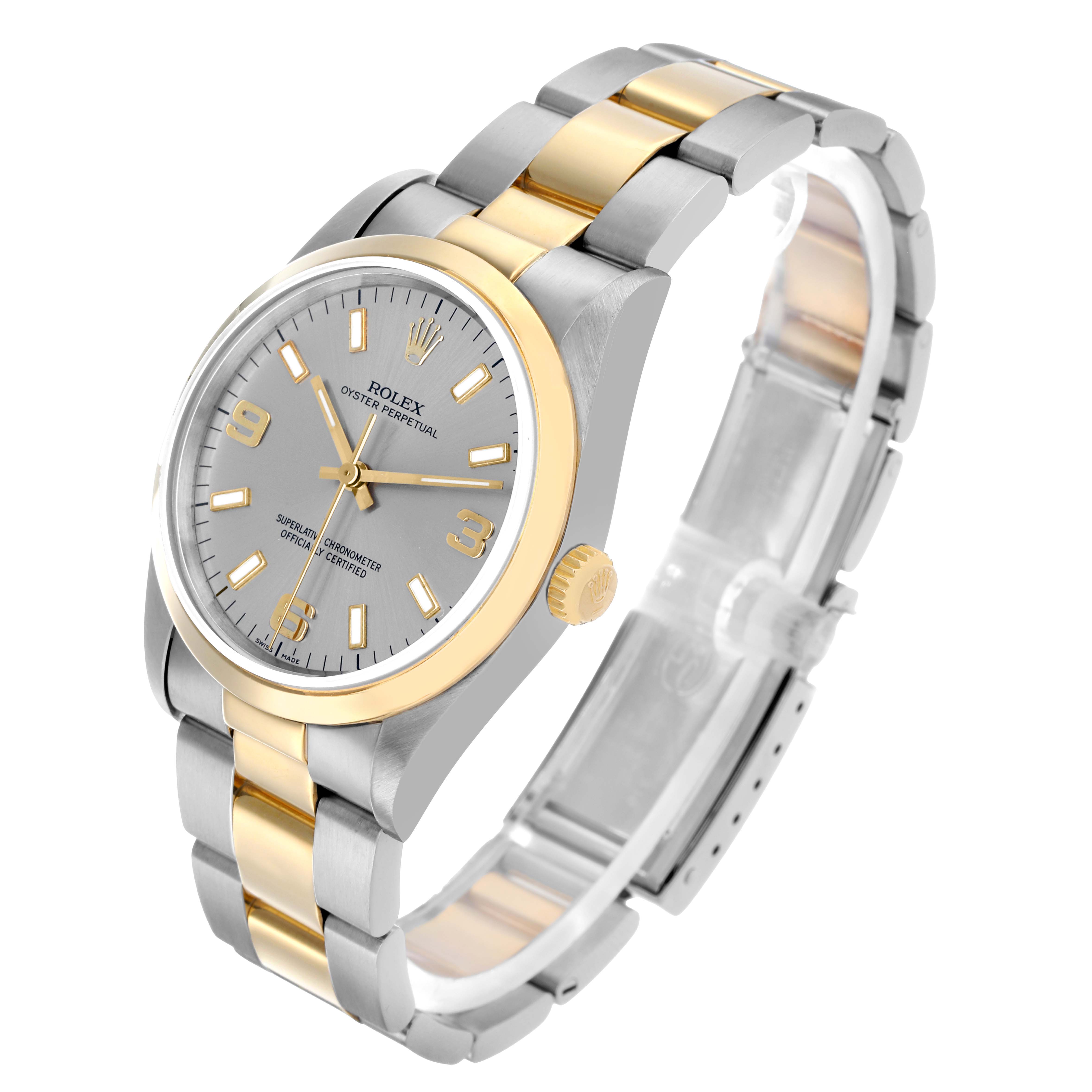 The Rolex Oyster Perpetual 14203 Men
s Steel and Gold (two tone) Silver Dial watch is shown at a three-quarter angle, highlighting the dial, case, crown, and two-tone bracelet.