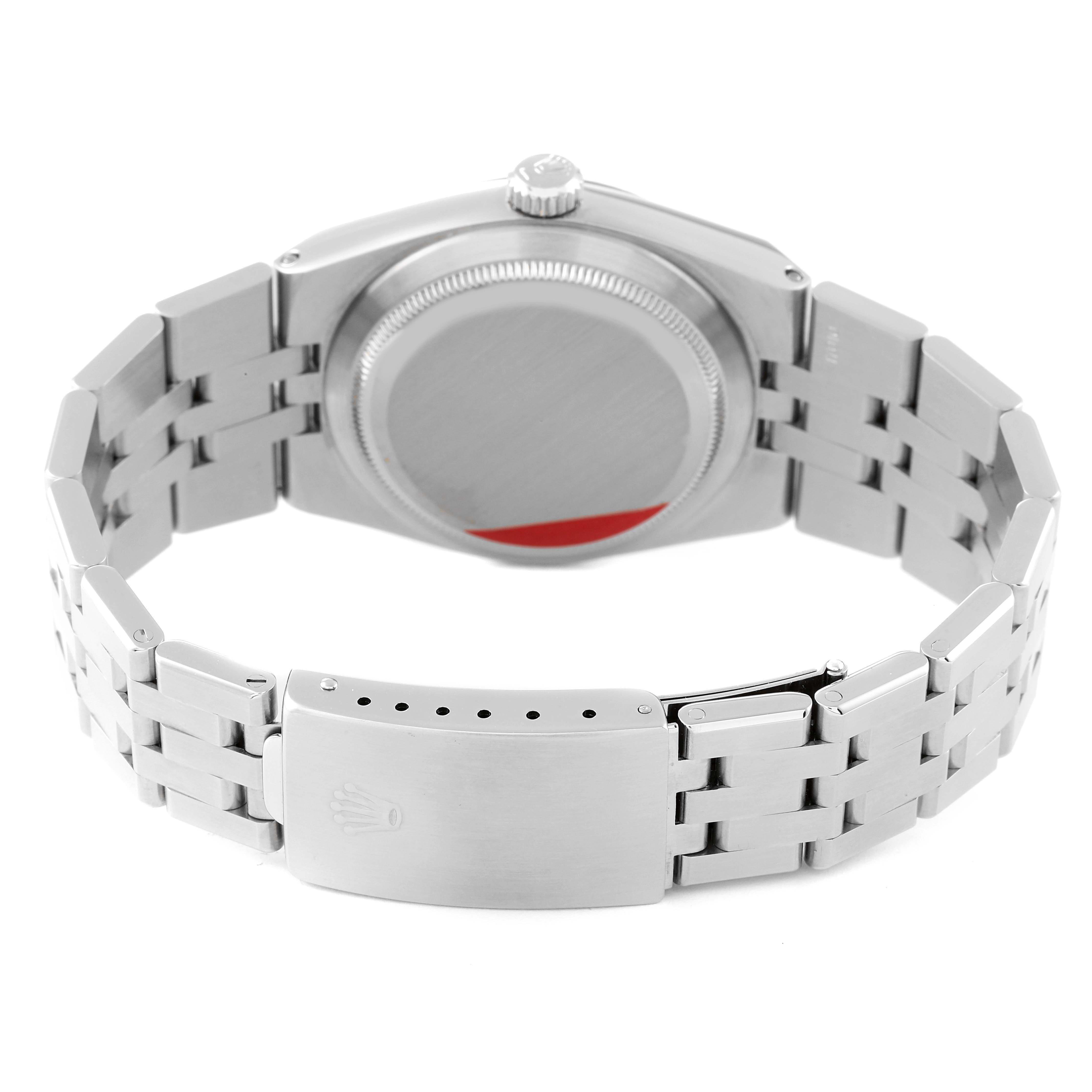 The image shows the back view of a Rolex Oysterquartz 17014 Men's Stainless Steel Silver Dial 17014 Men's Stainless Steel Silver Dial watch, highlighting the case back, crown, and bracelet clasp.