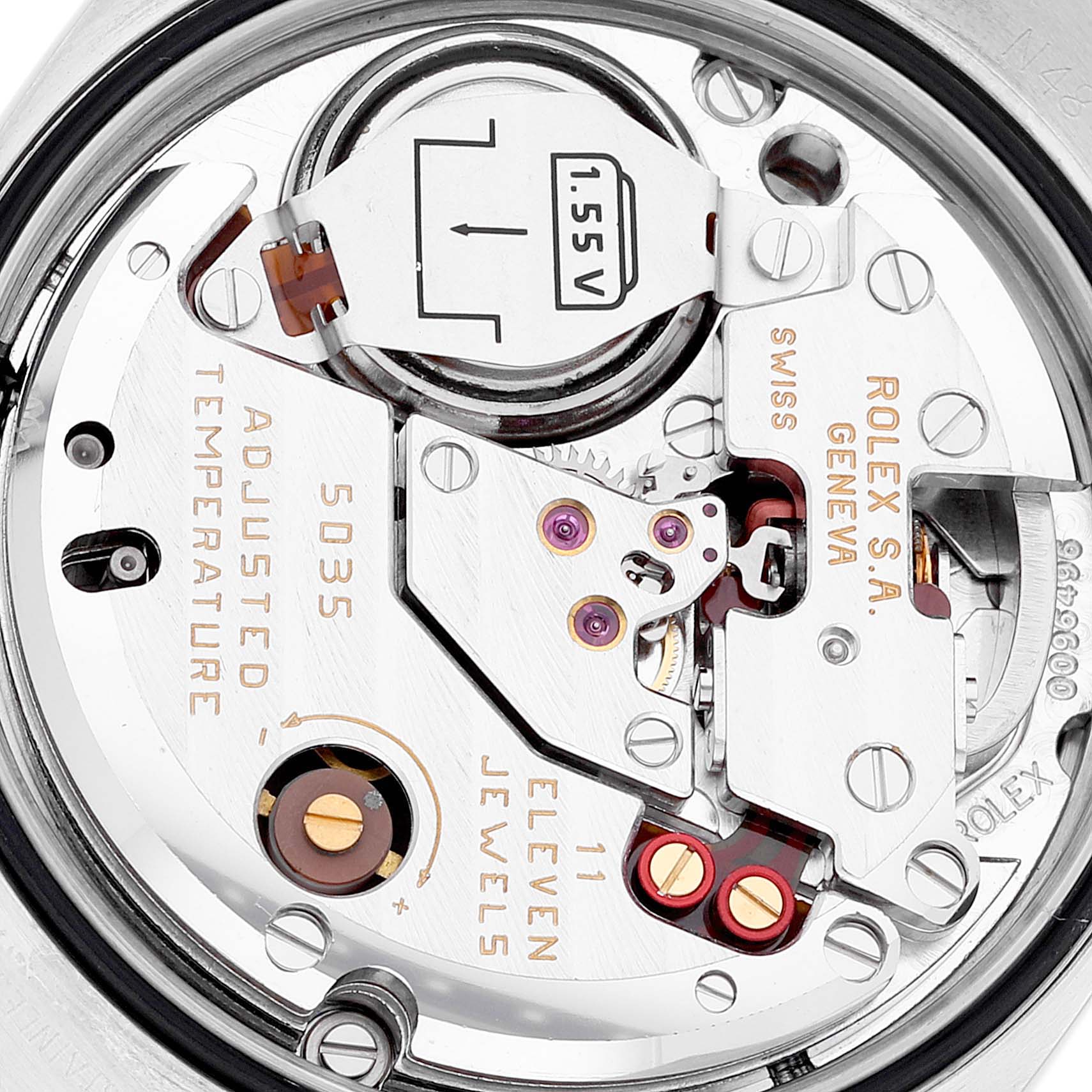 This is a close-up view of the Rolex Oysterquartz 17014 Men's Stainless Steel Silver Dial 17014 Men's Stainless Steel Silver Dial watch movement, showing the internal components and battery.