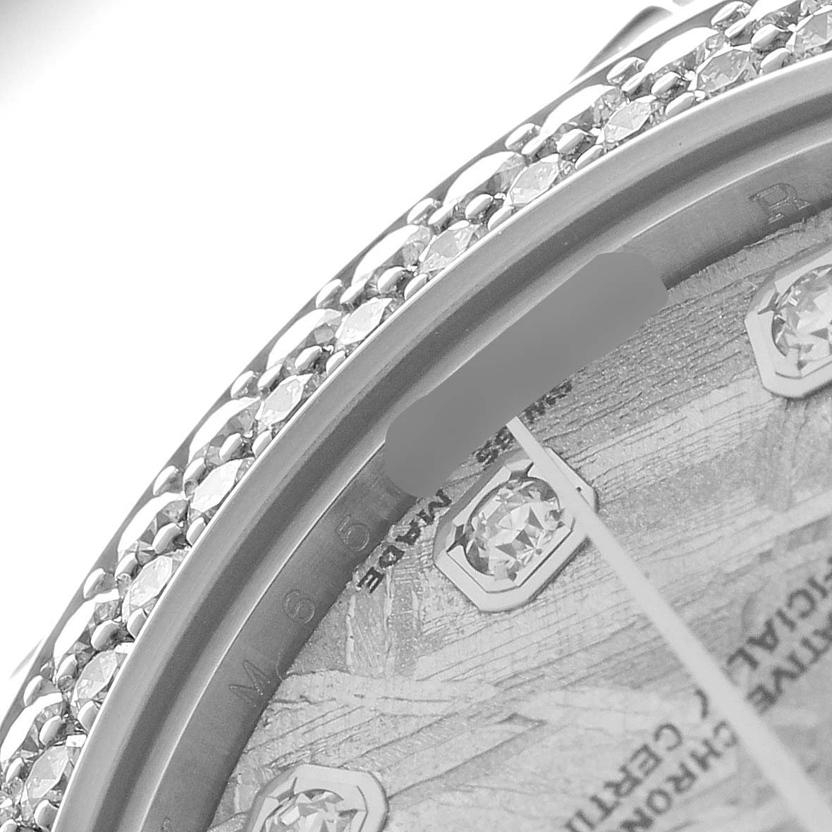 The image shows a close-up angle of the Rolex Pearlmaster 81339 Women's White Gold Silver Dial's diamond-set bezel and part of the dial with diamond indices.