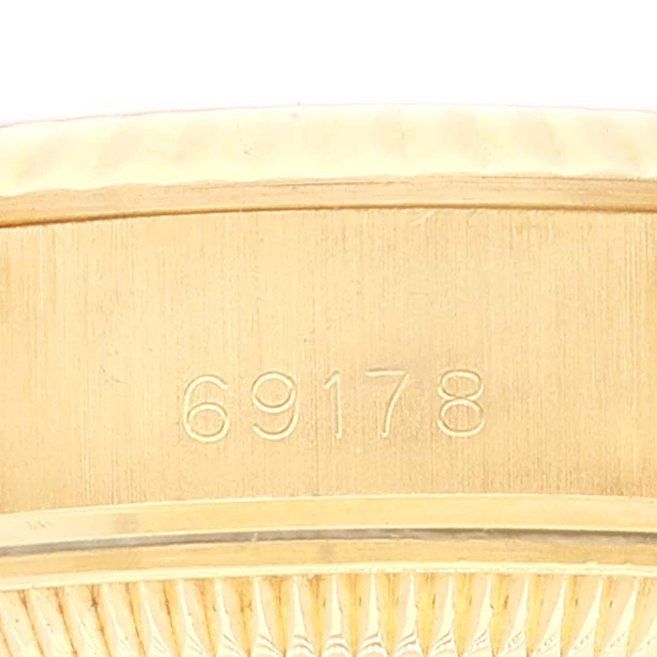 This close-up image shows the model number "69178" engraved on the case of a Rolex President 69178 Women
s Yellow Gold Champagne Dial 69178 Women
s Yellow Gold Champagne Dial watch.
