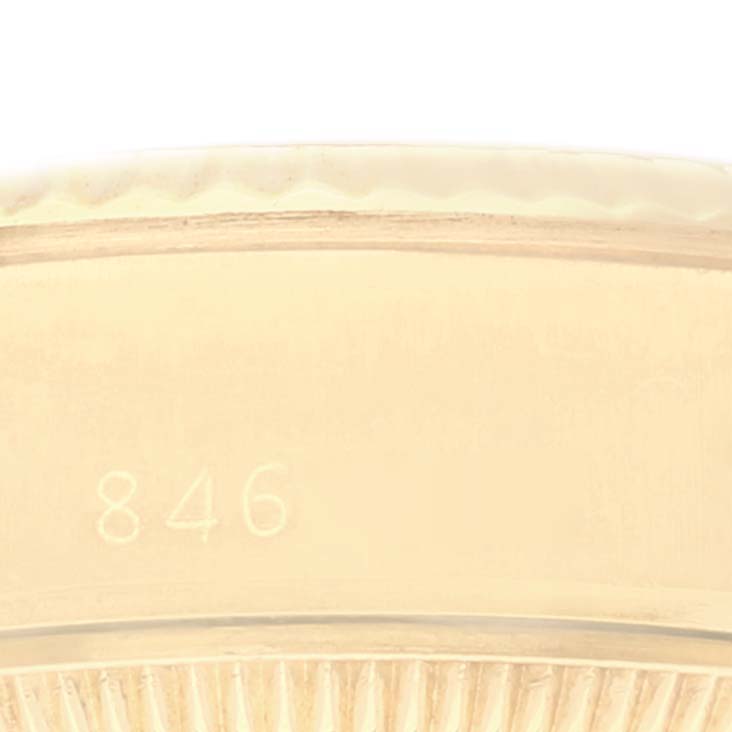 This image shows a close-up of the engraving and edge detail on the bezel of a Rolex President 69178 Women
s Yellow Gold Champagne Dial 69178 Women
s Yellow Gold Champagne Dial model watch.