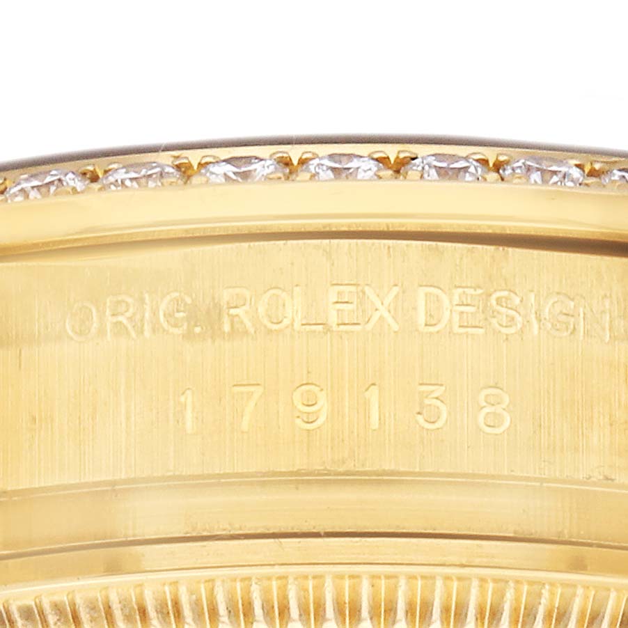 The image shows the side profile of a Rolex President 179138 Men's Yellow Gold Mother of Pearl Dial watch case with some engraving visible.