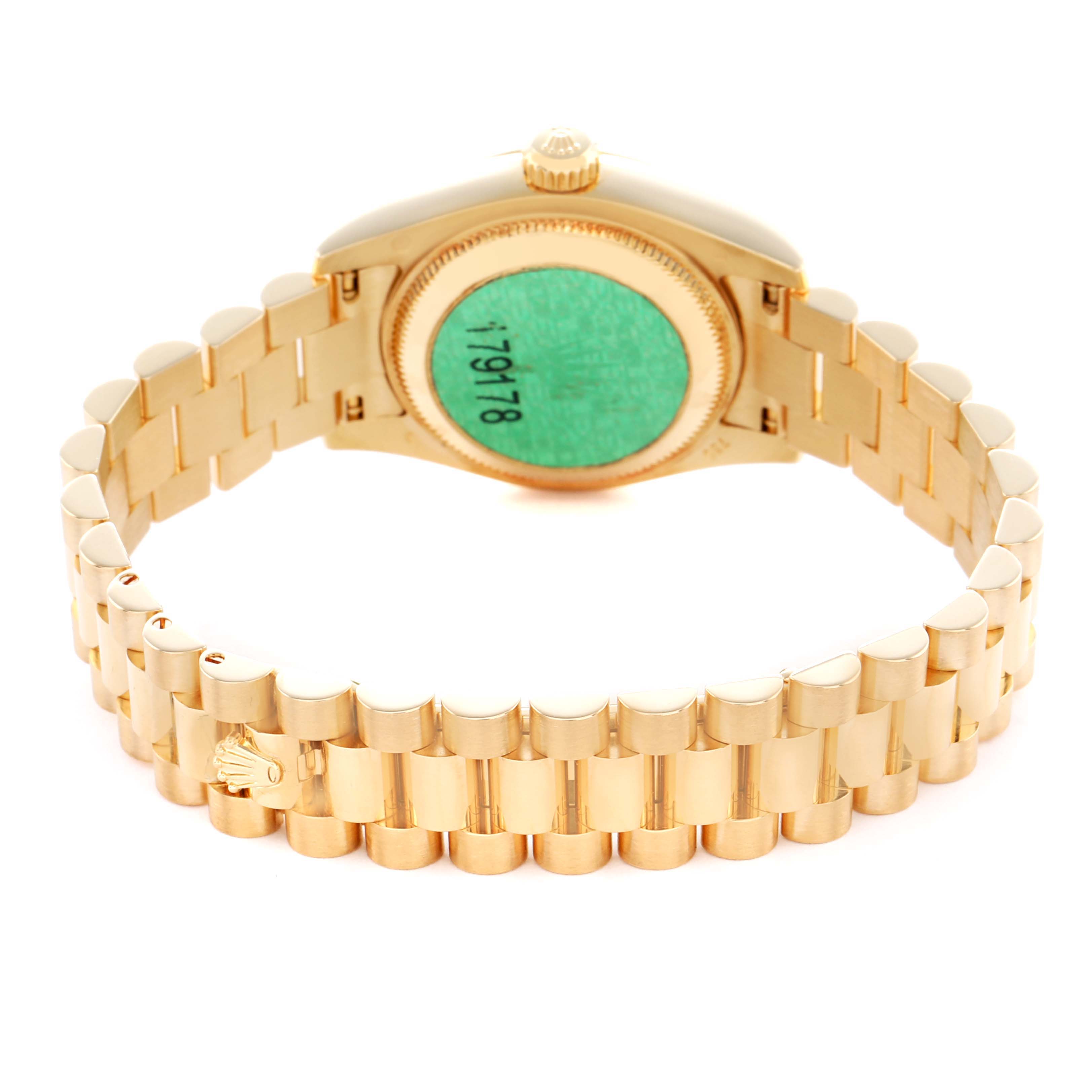 The image shows the back view of a Rolex President 179178 Women's Yellow Gold White Dial model watch, highlighting its case back and gold bracelet clasp.