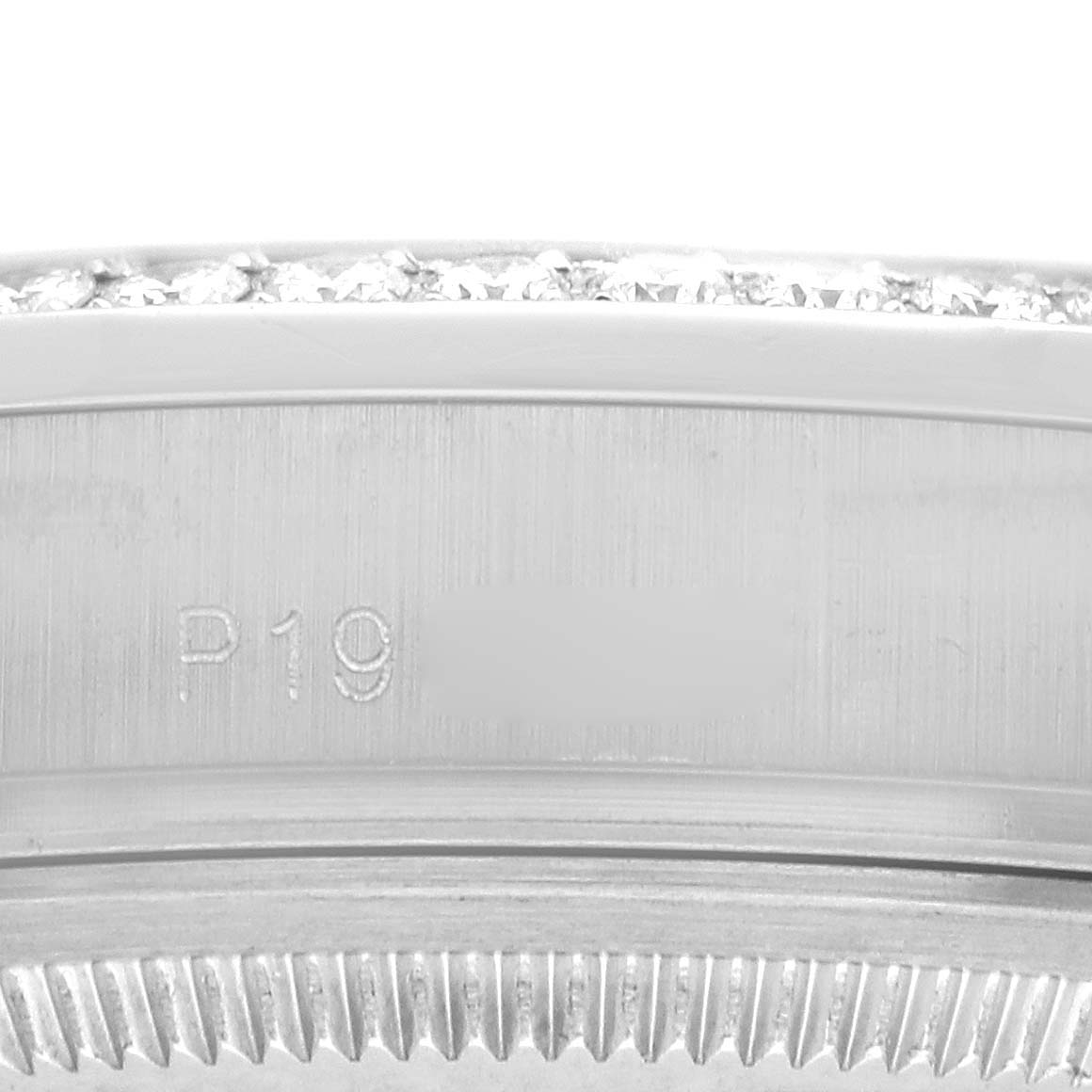 The image shows a close-up of the bezel and side case of a Rolex President 118386 Men's Platinum Silver Dial model with diamond detailing.