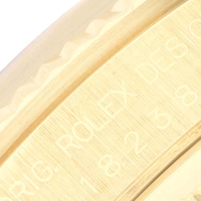 The image shows a close-up of a segment of the Rolex President 18238 Men's Yellow Gold Beige Dial 18238 Men's Yellow Gold Beige Dial model, focused on the engraved text on the inner side of the bezel.