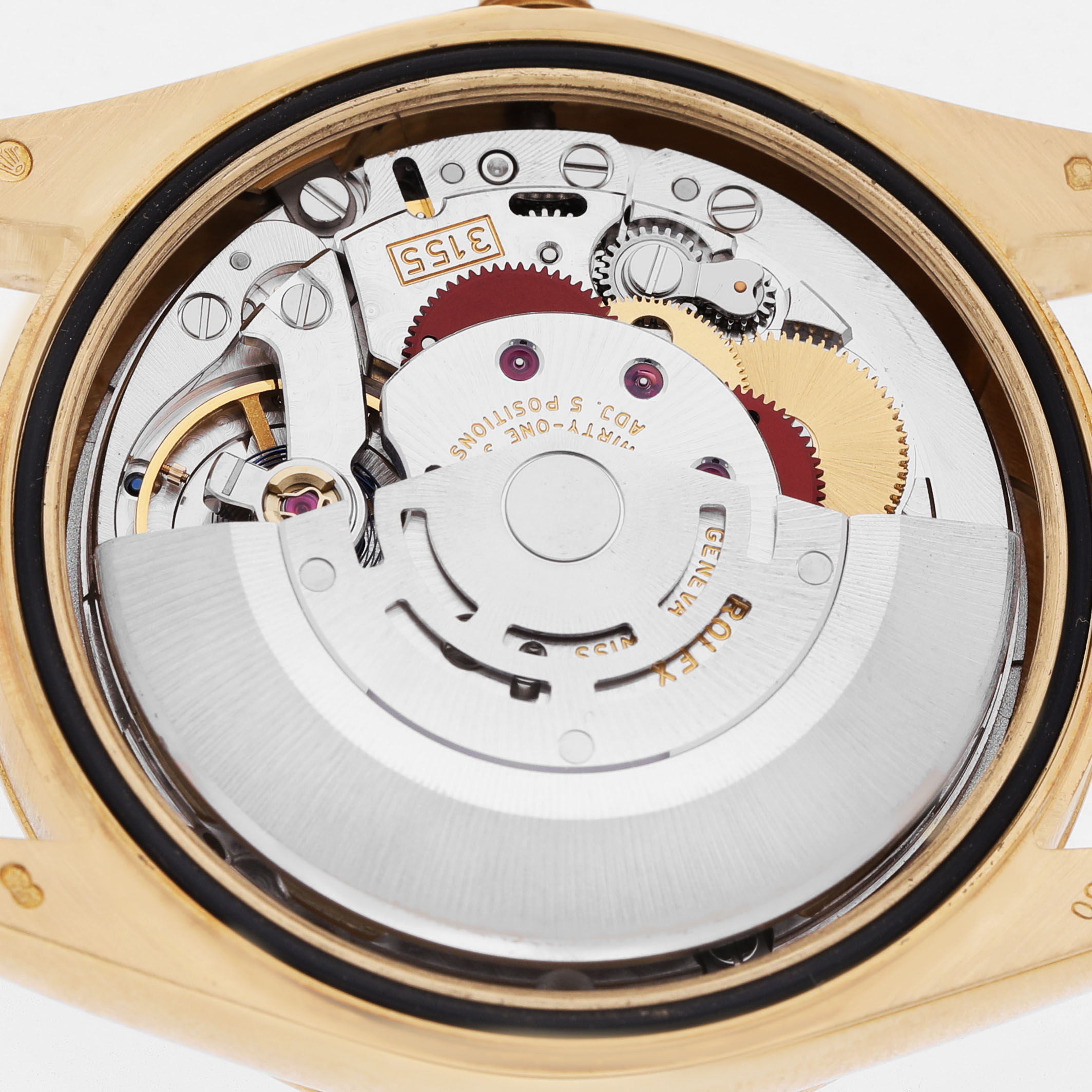 The image shows the movement of a Rolex President 118238 Men's Yellow Gold Mother of Pearl Dial watch from the back, highlighting its intricate mechanical components.