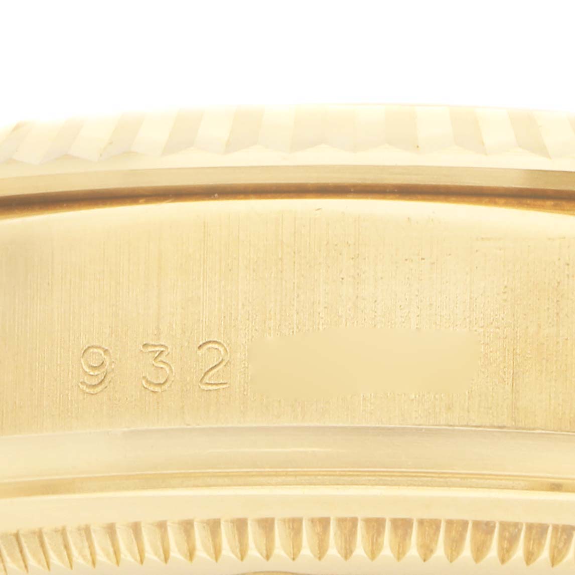 The image shows a close-up of the side of the Rolex President 18038 Men
s Yellow Gold Champagne Dial model, highlighting the gold casing and engraved numbers.