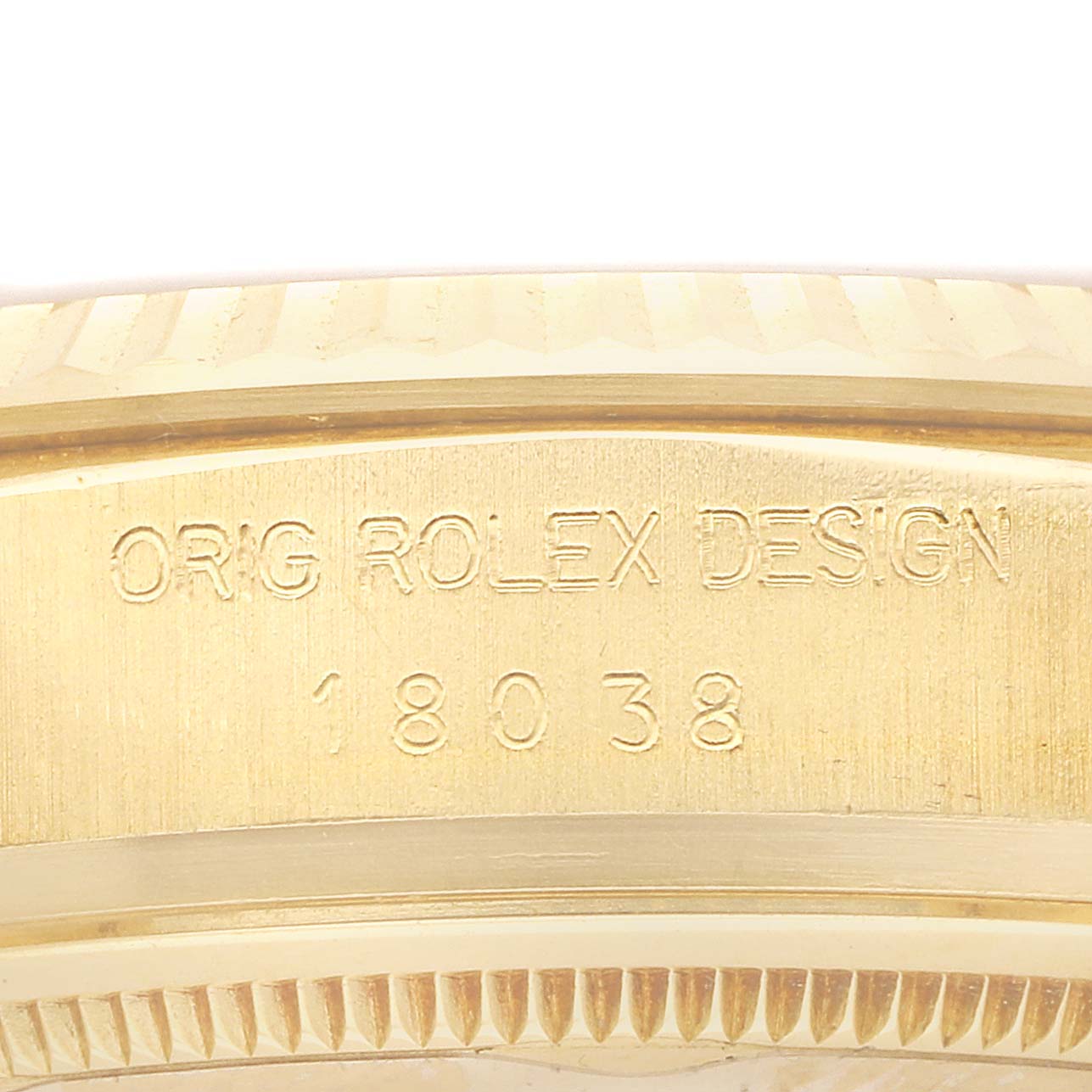 The image shows the side view of the Rolex President 18038 Men
s Yellow Gold Champagne Dial model, highlighting the engraved case design and model number.