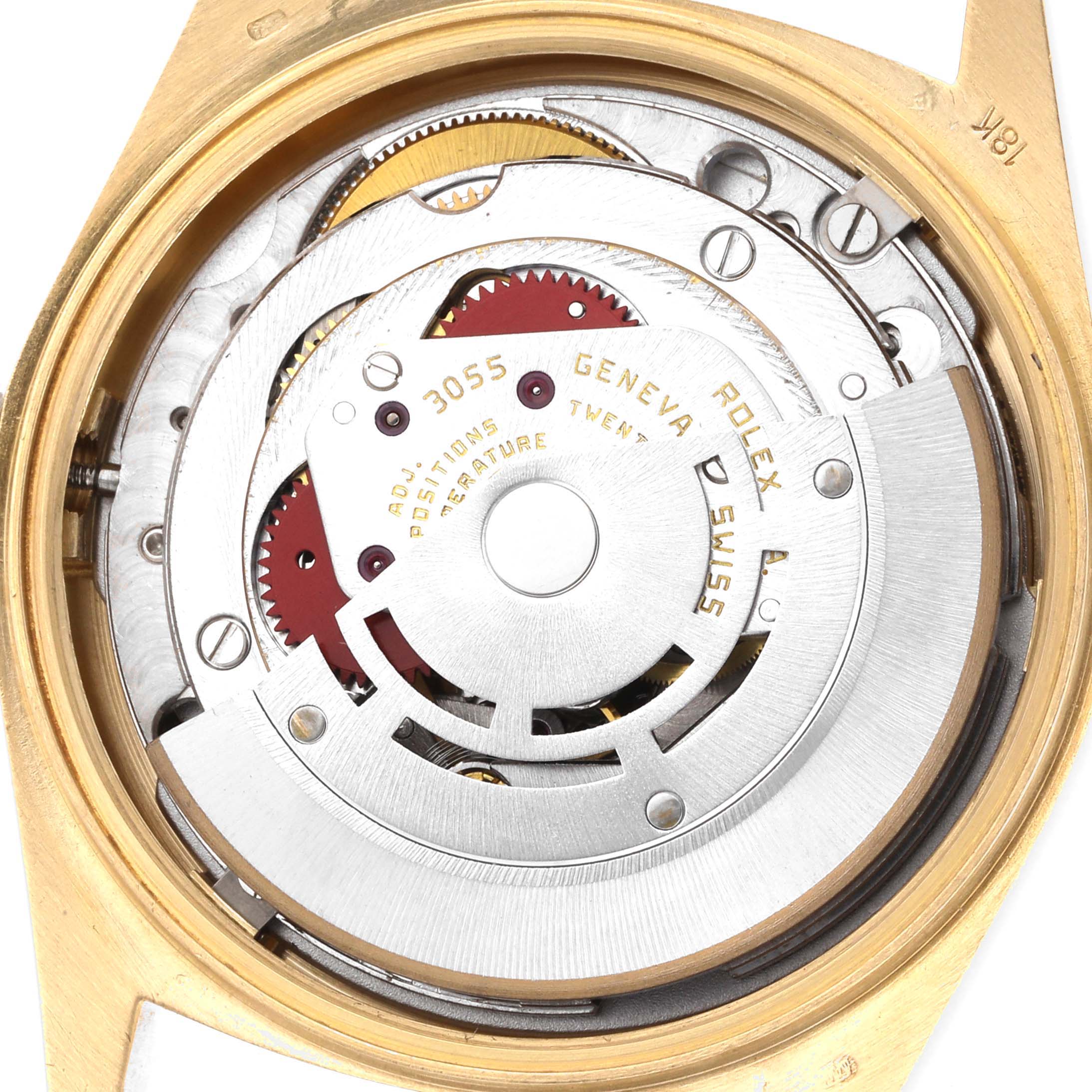 The image shows the internal movement of a Rolex President 18038 Men
s Yellow Gold Champagne Dial watch, featuring components like gears and plates, viewed from the back.