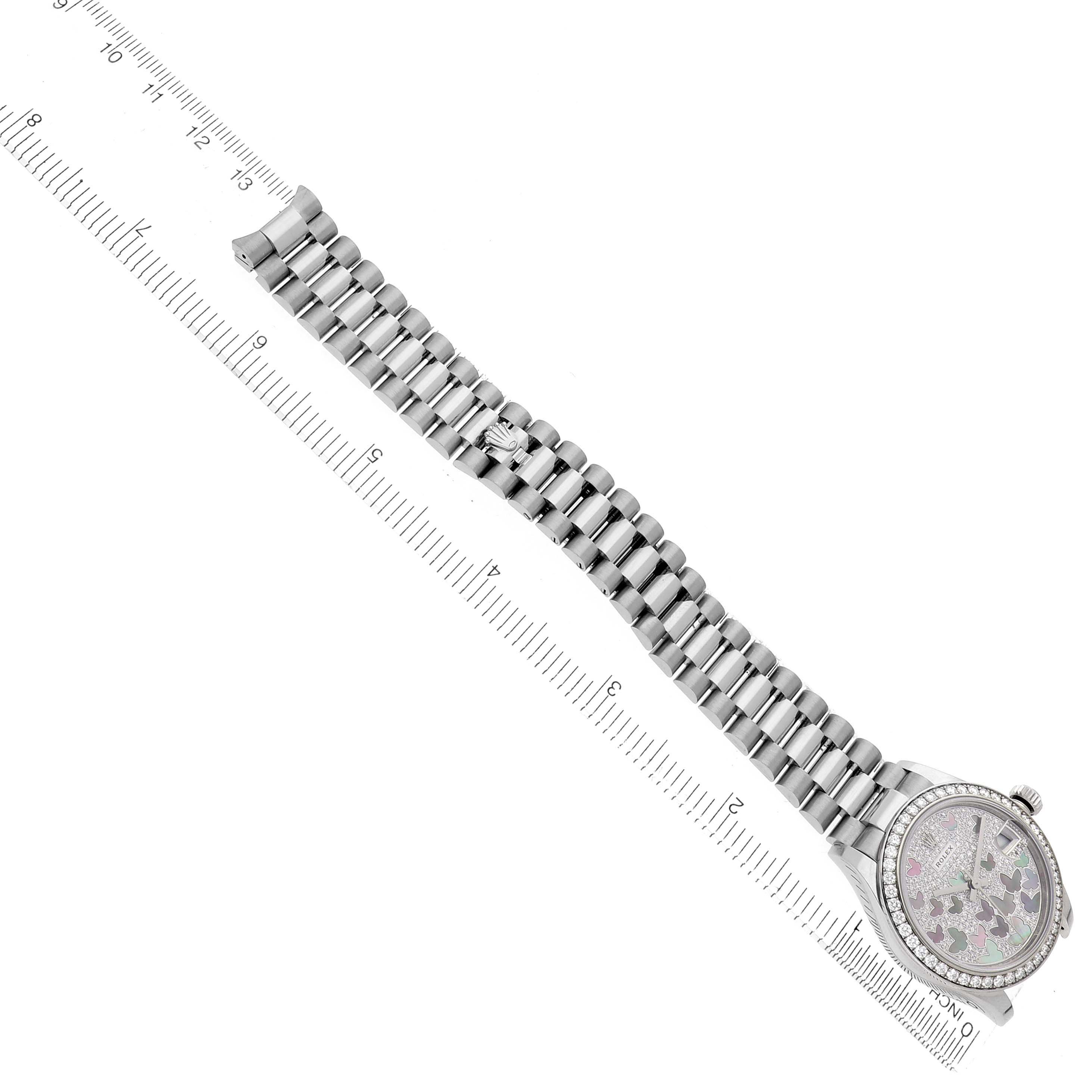 The Rolex President 278288 Women's White Gold Mother of Pearl Dial model watch is shown from a top-down angle, displaying the bracelet fully extended alongside a ruler.