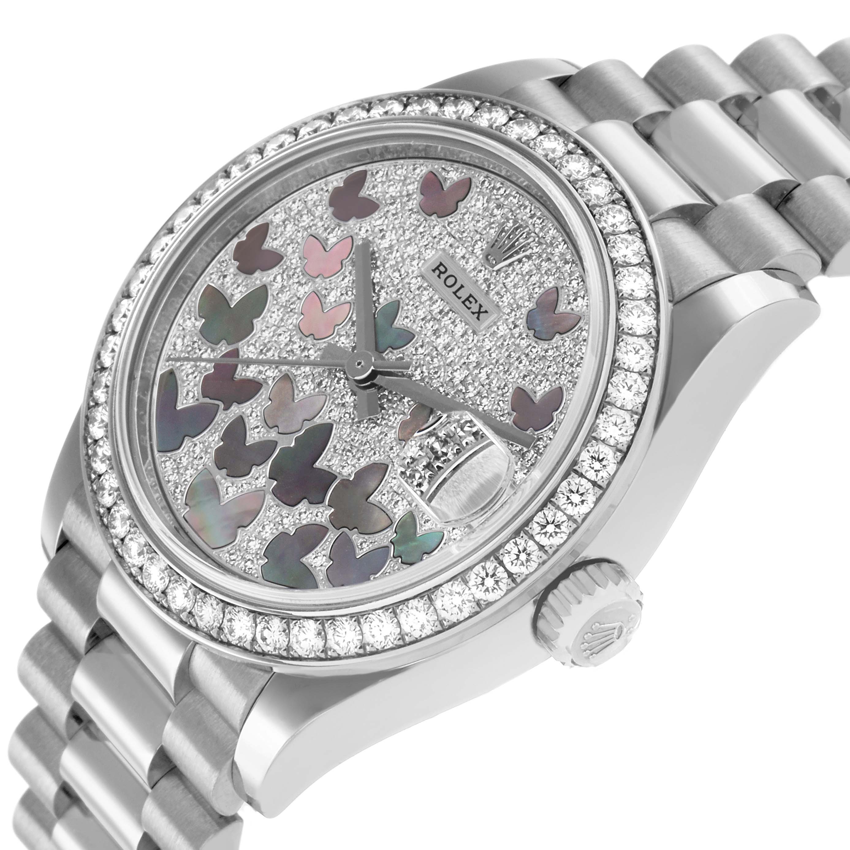 The Rolex President 278288 Women's White Gold Mother of Pearl Dial watch is shown at an angle highlighting the bezel, dial with butterfly designs, and bracelet.