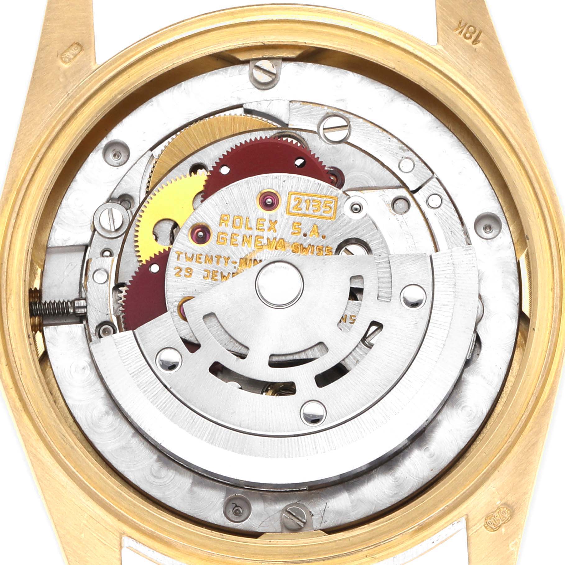 The image shows the movement mechanism of a Rolex President 68278 Women's Yellow Gold Champagne Dial watch, viewed from the back with its intricate gears and rotor visible.