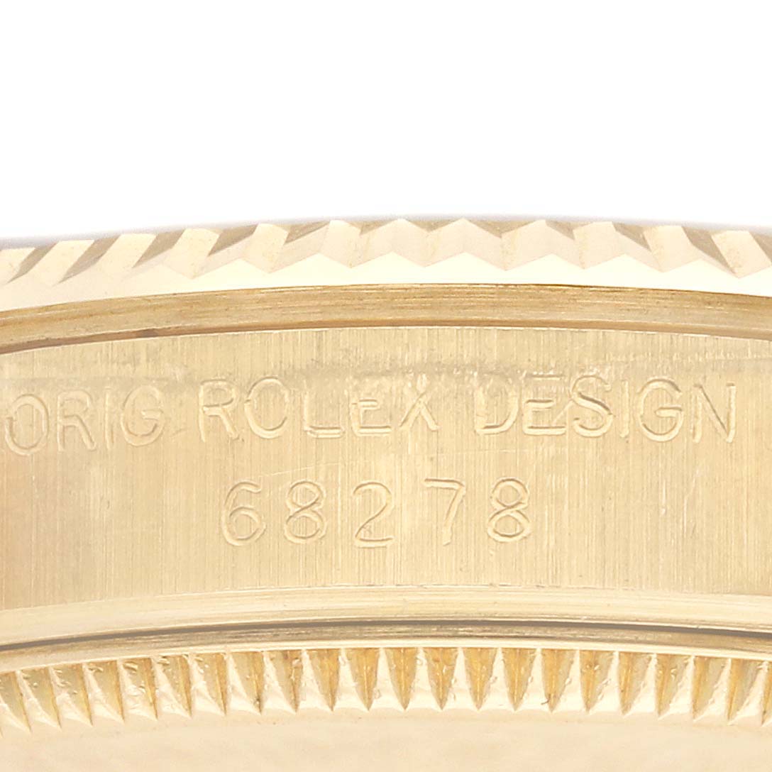 The image shows a close-up of the side of a Rolex President 68278 Women's Yellow Gold Champagne Dial model, highlighting the engraved "ORIG ROLEX DESIGN 68278."