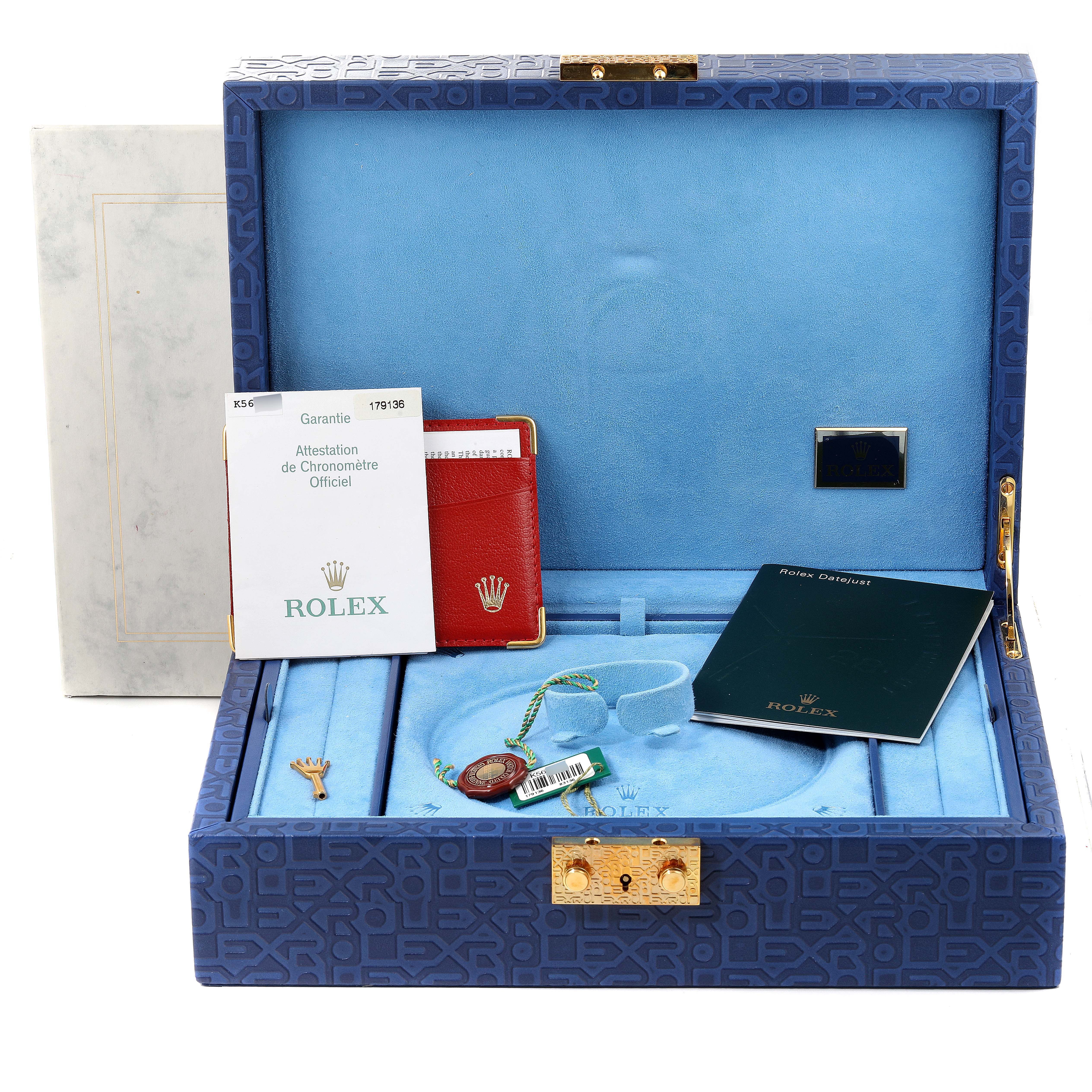 This image shows the packaging and accessories of a Rolex President 179136 Women's Platinum Mother of Pearl Dial 179136 Women's Platinum Mother of Pearl Dial model watch, including booklets, tags, and the box.