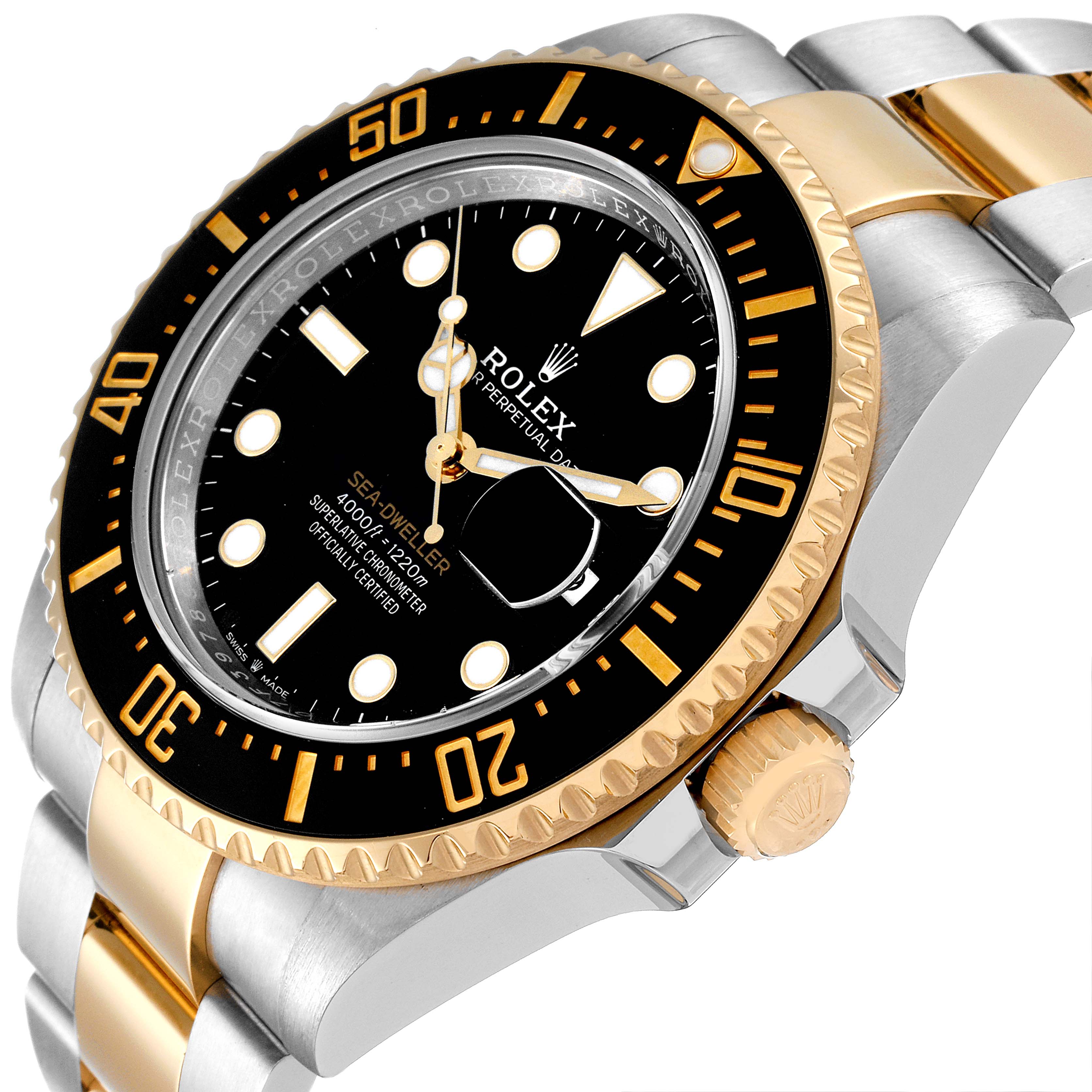 The image shows a close-up angle of the Rolex Sea-Dweller 126603 Men
s Steel and Gold (two tone) Black Dial 126603 Men
s Steel and Gold (two tone) Black Dial watch, highlighting its face, bezel, and part of its bracelet.
