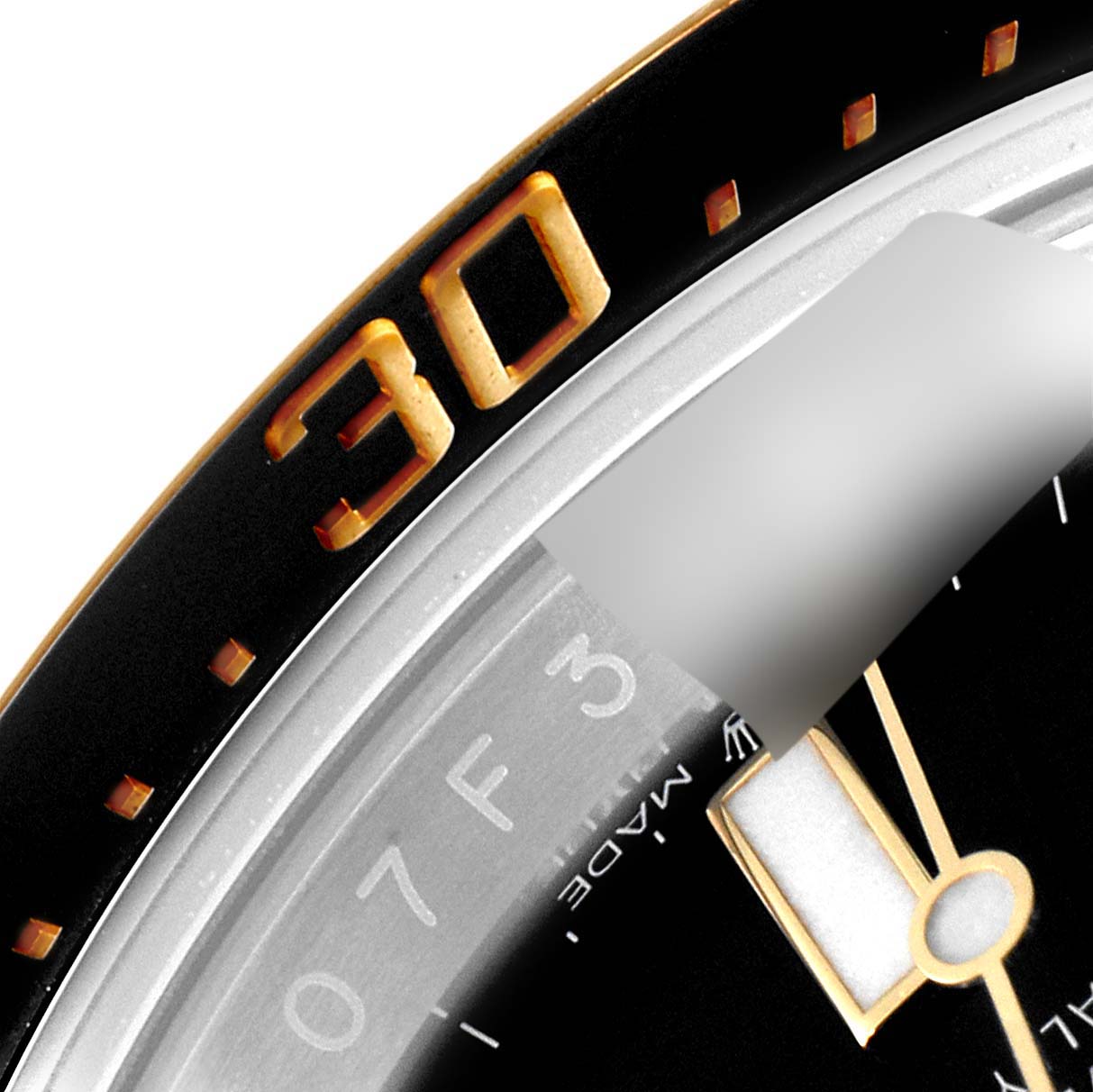 Close-up view of the bezel and part of the dial of a Rolex Sea-Dweller 126603 Men
s Steel and Gold (two tone) Black Dial 126603 Men
s Steel and Gold (two tone) Black Dial watch, showing the 30-minute marker.